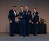 Col. John S. Tuohy, Washington Air National Guard Assistant Adjutant General, Chief Master Sgt. James W. Hotaling Air National Guard Command Chief and Chief Master Sgt. Trisha D. Almond Washington Air National Guard Command Chief,  present Air National Guard Staff  Sgt. Nathan Lucas, Western Area Defense Sector,  tracking technician, the Airman of the Year trophy at the Washington Air National Guard Annual Awards Banquet at the Spokane Convention Center, Spokane, Wash. Feb. 8, 2014.  Lucas was awarded the trophy for his outstanding contributions to the Washington Air National Guard over the last year. (U.S. Air National Guard Photo by Tech. Sgt. Michael L. Brown/Released)