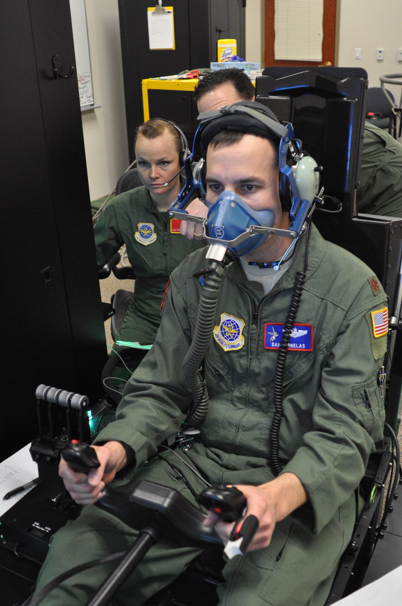 Maj. David Orneles, a 93rd Air Refueling Squadron pilot, accomplishes his refresher physiology training with the Reduced Oxygen Breathing Device while flying the Hypoxia Familiarization Trainer at the 92nd Medical Group Aerospace Physiology facility at Fairchild Air Force Base, Wash., Feb. 19, 2014. During this hands-on exercise, Orneles’ training includes identifying symptoms of hypoxia while performing the duties of a KC-135 Stratotanker pilot at a breathing altitude of 25,000 feet. (U.S. Air Force photo by Scott King/Released) 

