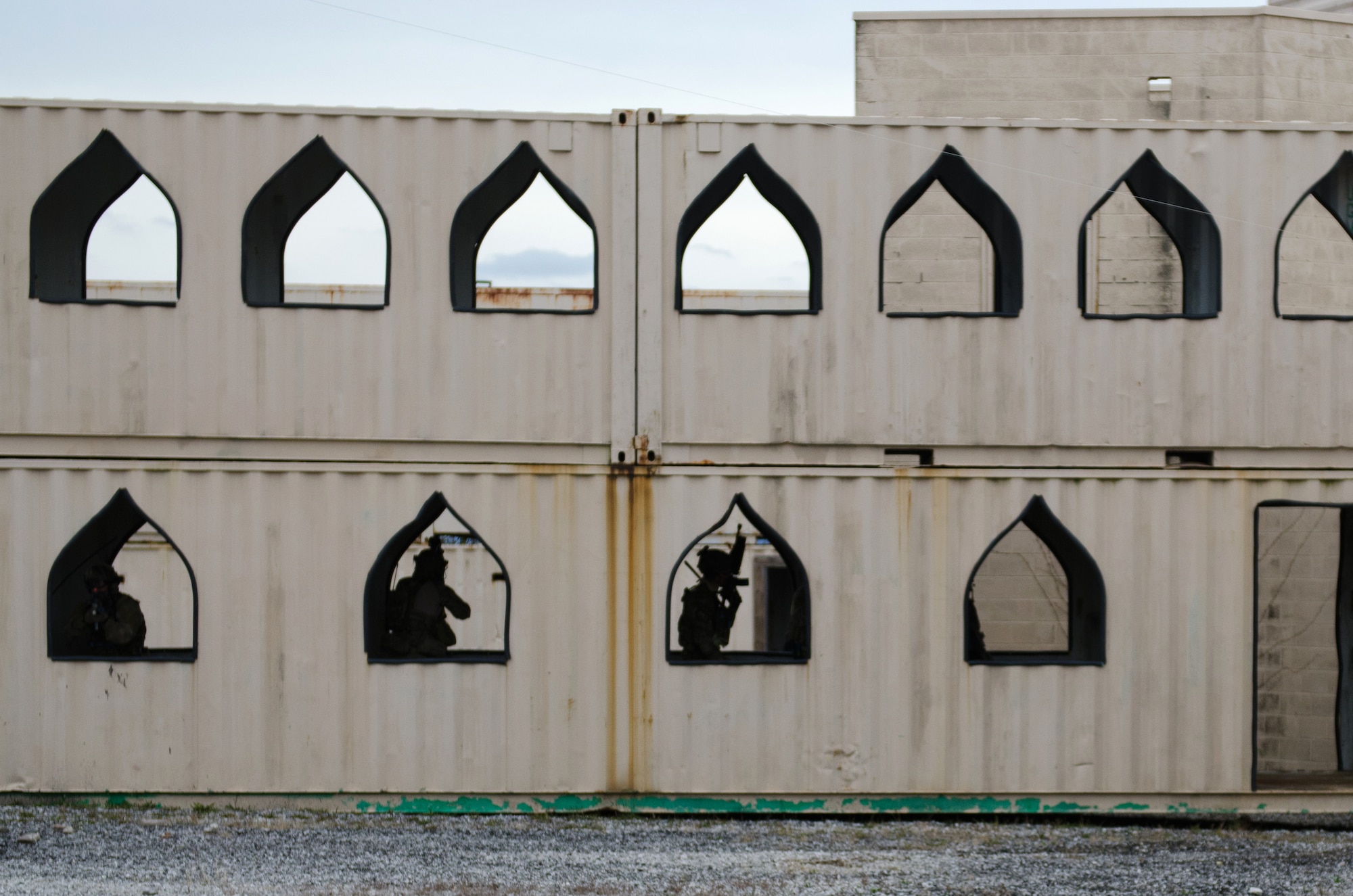 Members of the Kentucky Air National Guard’s 123rd Special Tactics Squadron clear a building during close-quarters combat training at Zussman Range at Fort Knox, Ky., on Nov. 21, 2013. The Airmen were practicing insertions, extractions and close-quarters combat in a simulated Afghan village. (U.S. Air National Guard photo by Master Sgt. Phil Speck)