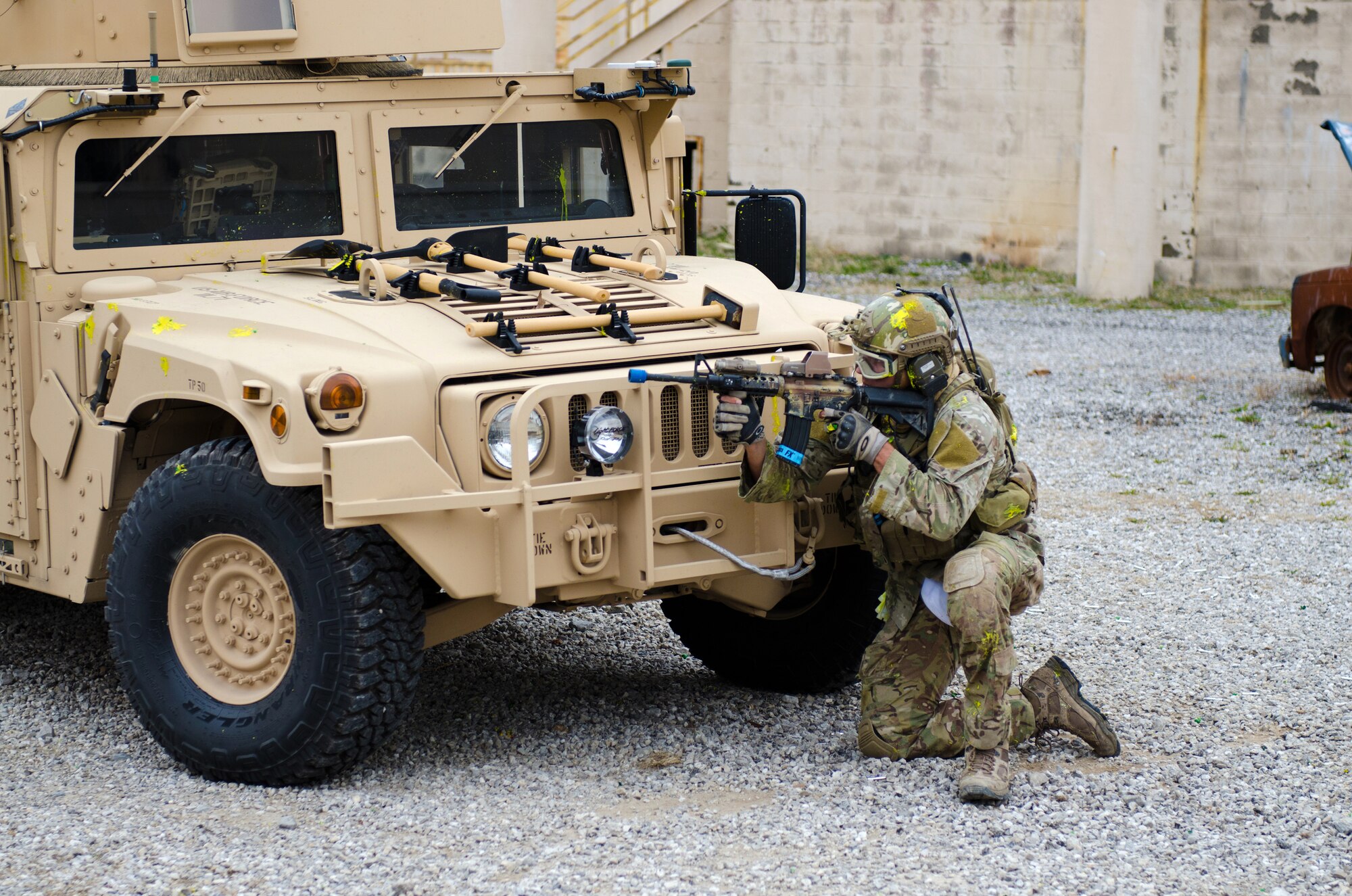 A member of the Kentucky Air National Guard’s 123rd Special Tactics Squadron defends his position during training at Zussman Range at Fort Knox, Ky., on Nov. 21, 2013. The Airman and his teammates were practicing insertions, extractions and close-quarters combat in a simulated Afghan village. (U.S. Air National Guard photo by Master Sgt. Phil Speck)