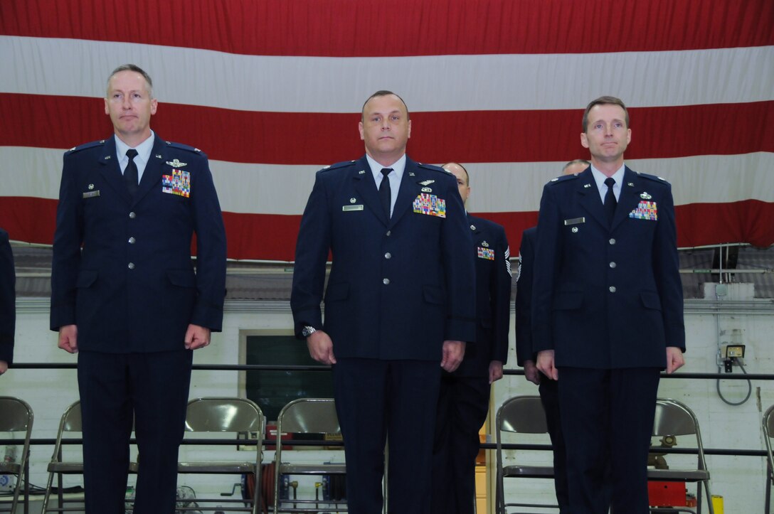 Col. Dar Craig, Lt. Col. Troy Drennan and Lt. Col. Jonathan Boyd stand at attention during a change of command ceremony held at the Utah Air National Guard Base in Salt Lake City, Utah, February 9, 2014.  The Base held five change of commands today. Drennan assumed command of the 169th Intelligence Squadron after Boyd relinquished command. (Utah Air National Guard photo by A1C Emily Hulse) (Released)