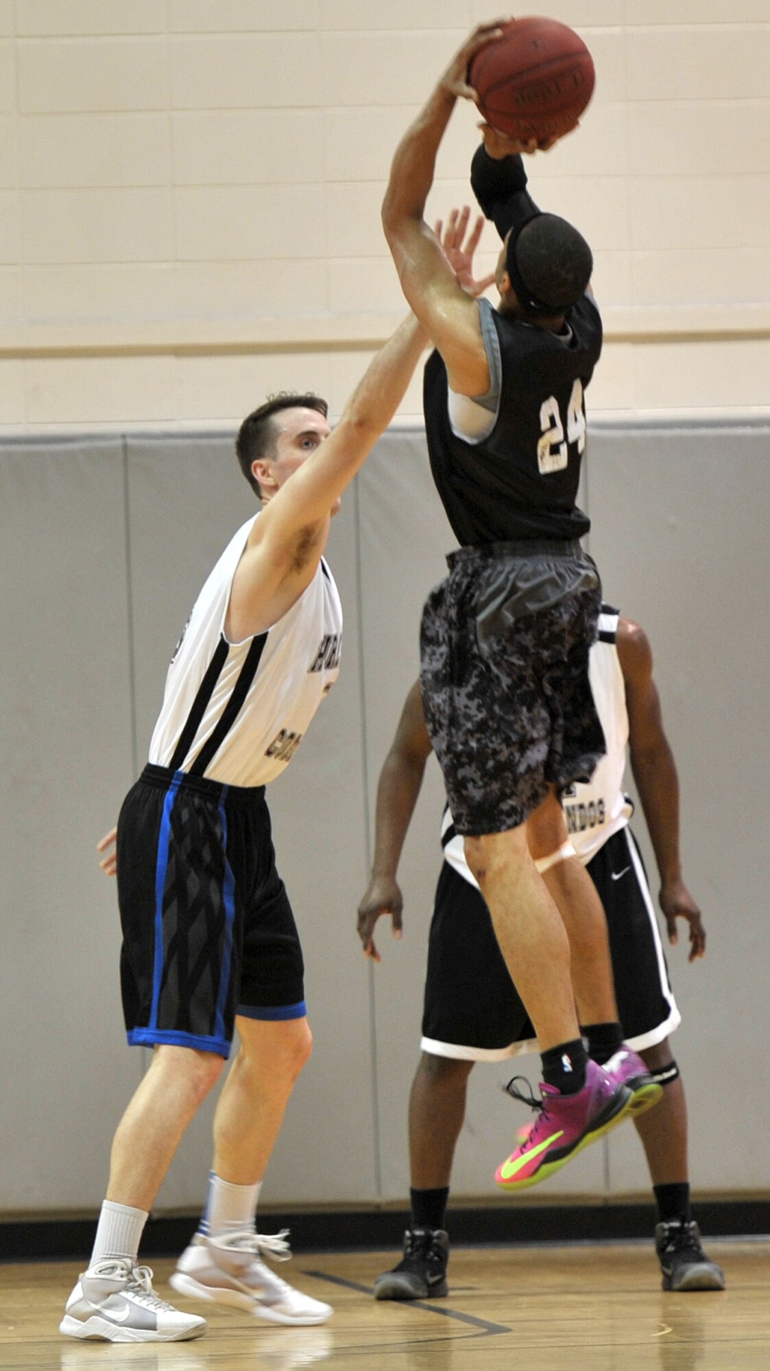 Michael Fitzgerald, Hurlburt Commandos forward, blocks Darnell Bing’s, Gordon Eagles point guard, sight during the final game of the Southeast Military Athletic Conference Basketball Tournament at the Aderholt Fitness Center on Hurlburt Field, Fla., Feb. 17, 2014. The Commandos won the tournament and are scheduled to compete against 15 other teams at the National Military Basketball Classic in San Antonio. (U.S. Air Force photo/Senior Airman Kentavist P. Brackin) 