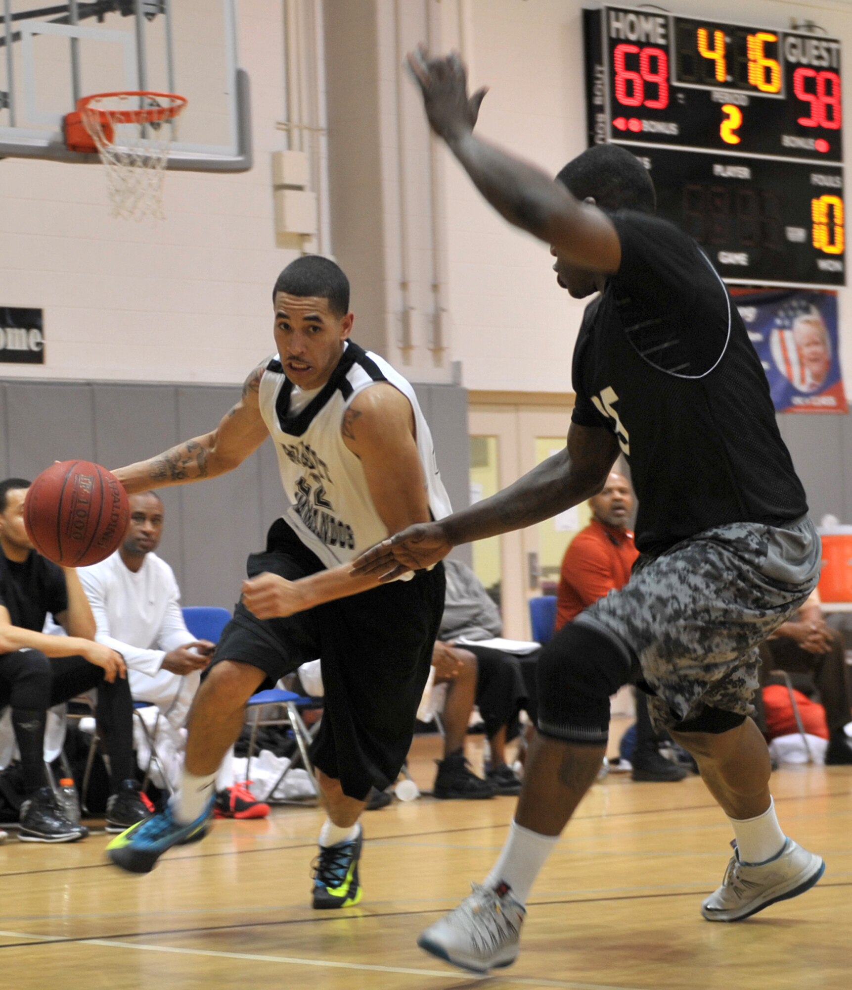 Andre Harp-Thomas, Hurlburt Commandos guard, attempts to dribble past MacArthur Jones, Gordon Eagles point guard, at the Aderholt Fitness Center on Hurlburt Field, Fla., Feb. 17, 2014. “We usually play man-to-man defense, but because of our lack of players, we had to play zone,” said Eddie Byrd, Eagles coach. (U.S. Air Force photo/Senior Airman Kentavist P. Brackin) 