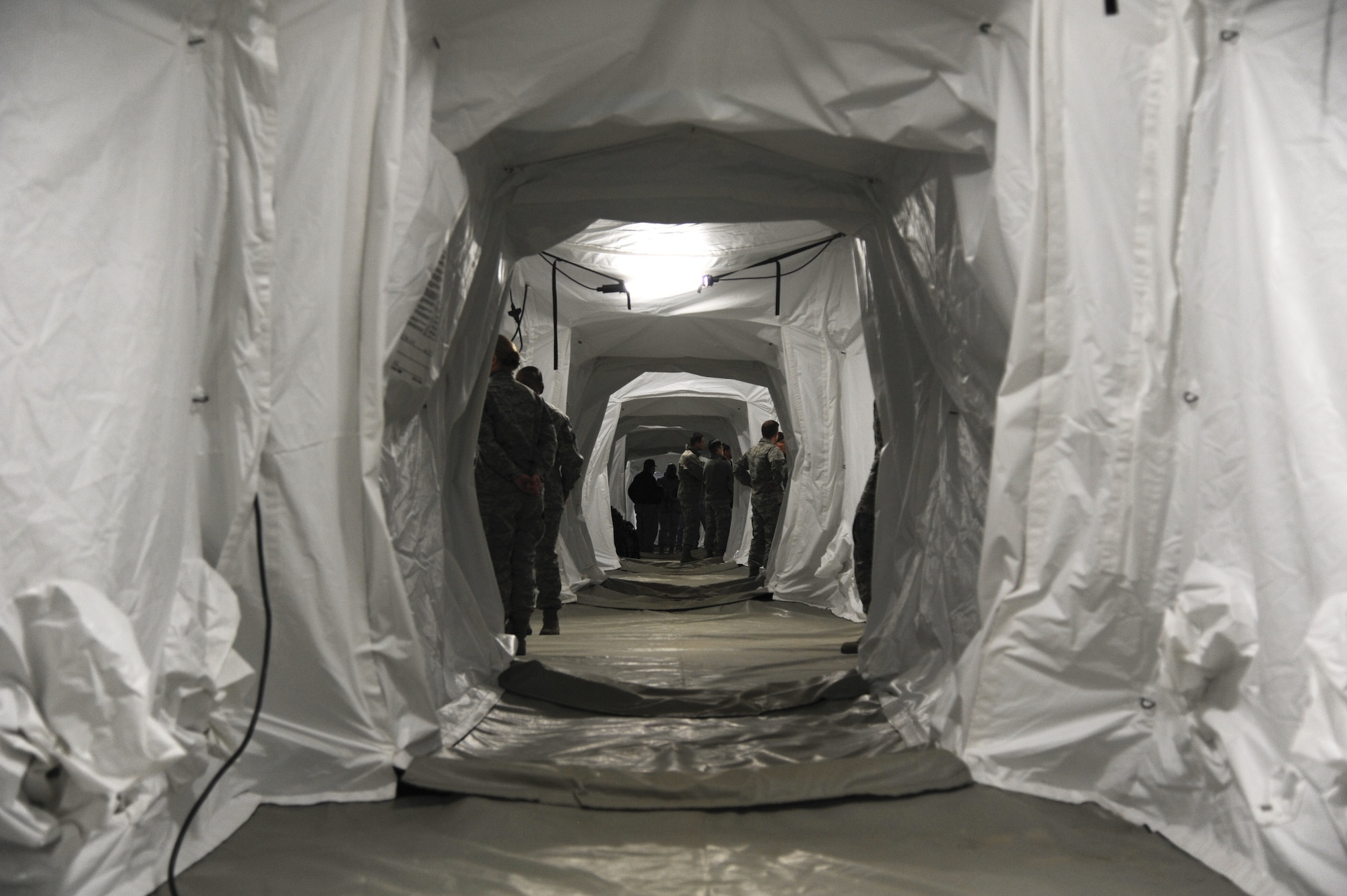 The main corridor of the new tent system for the Expeditionary Medical Support System 15 February, 2014. The new tent structure contains collective protection materials to protect against chemical, biological, radiological and nuclear attacks. The materials are incorporated into the outer skin of the structure, making it easier for the overall set up. (U.S. Air Force photo by Staff Sgt. Steve Stanley/Released)