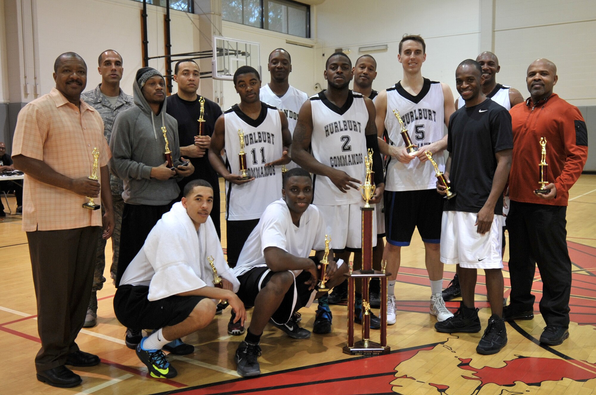 The Hurlburt Commandos Basketball Team poses for a photo at at the Aderholt Fitness Center on Hurlburt Field, Fla., Feb. 17, 2014. The Commandos defeated the No. 1 seeded team of the season, the Fort Gordon Eagels in the final game, 85-68, to win the tournament. The Commandos are scheduled to compete against 15 other teams at the National Military Basketball Classic in San Antonio. (U.S. Air Force photo/Senior Airman Kentavist P. Brackin) 