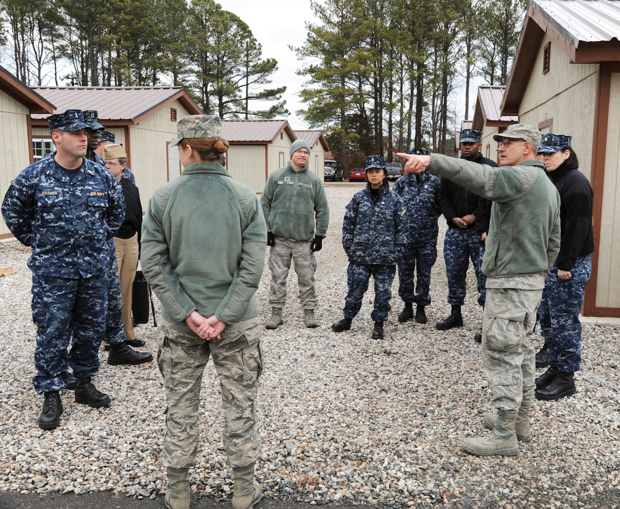 Navy personnel from the Naval Medical Center Portsmouth, Va., visit the Expeditionary Medical Support System exercise location 17 February, 2014. The visit was to see if the new tent systems and equipment can be incorporated into naval expeditionary operations. (U.S. Air Force photo by Staff Sgt. Steve Stanley/Released)