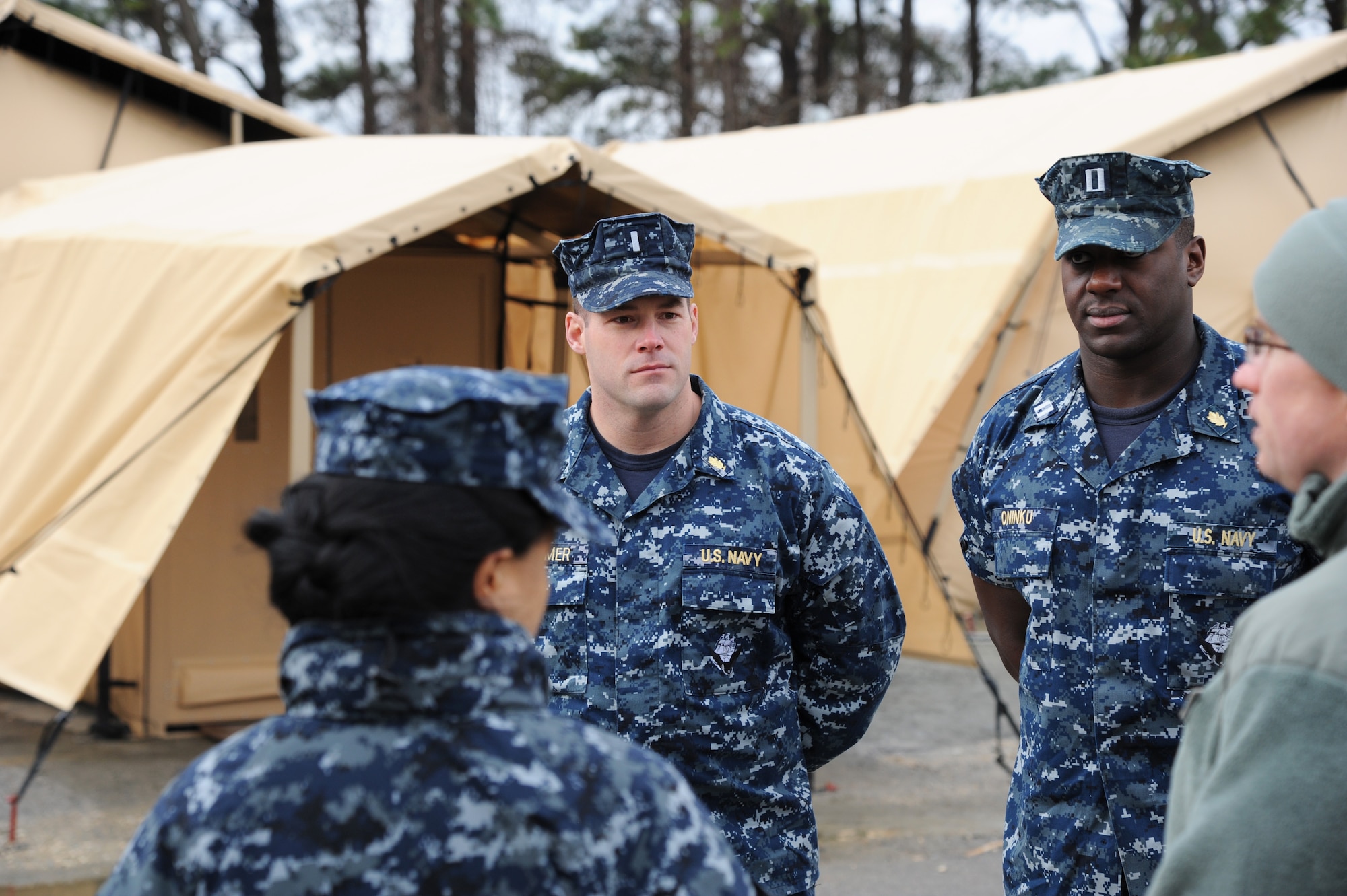 Navy personnel from the Naval Medical Center Portsmouth, Va., visit the Expeditionary Medical Support System exercise location to get a chance to see if they can incorporate the modernization of the new tent systems and equipment into their expeditionary operations. (U.S. Air Force photo by Staff Sgt. Steve Stanley/Released)