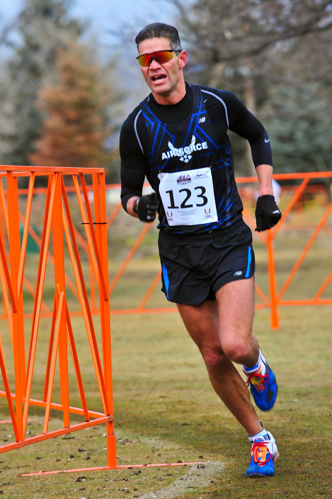 Air Force Reserve Chief Master Sgt. Alex C. Escarcega rounds a course barricade in good running form February 15, 2014 at Flatirons Golf Course in Boulder, Colo. Escarcega was the sole AF Reservist to compete in the 2014 Armed Forces Cross-Country Championship’s 8 kilometer event. Escarcega finished with a time of 34:24 in the Men’s Master category. Escarcega is assigned to the 310th Operations Group at Schriever Air Force Base, Colo., and serves as the organization’s chief enlisted manager. (U.S. Air Force photo/Tech. Sgt. Nicholas B. Ontiveros)