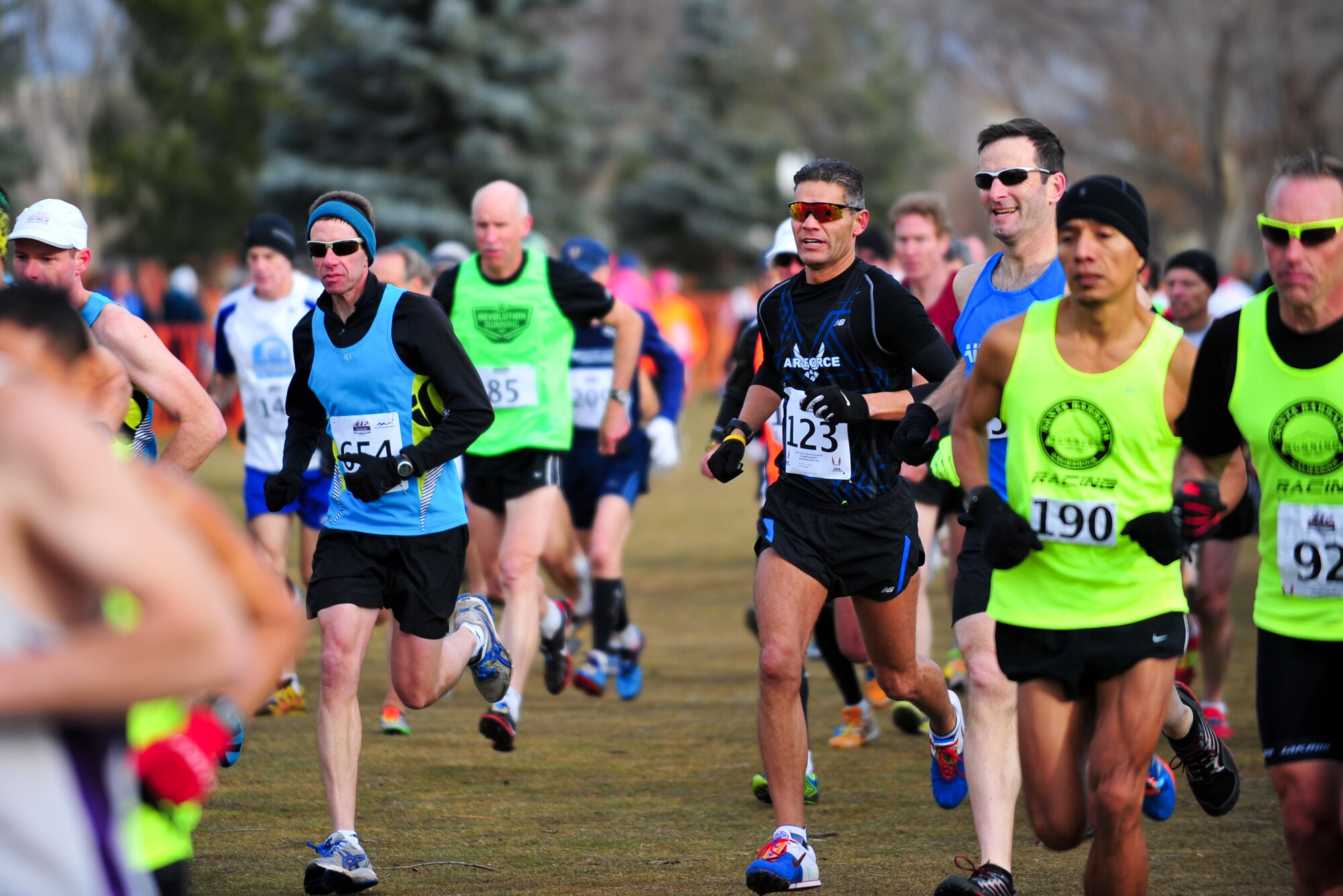 Air Force Reserve Chief Master Sgt. Alex C. Escarcega (bib number 123) is seconds into his race February 15, 2014 at Flatirons Golf Course in Boulder, Colo. Escarcega was the sole AF Reservist to compete in the 2014 Armed Forces Cross-Country Championship’s 8 kilometer event. Escarcega finished with a time of 34:24 in the Men’s Master category. Escarcega is assigned to the 310th Operations Group at Schriever Air Force Base, Colo., and serves as the organization’s chief enlisted manager. (U.S. Air Force photo/Tech. Sgt. Nicholas B. Ontiveros)