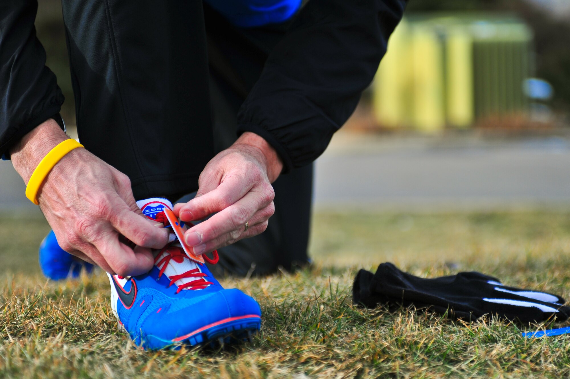 Air Force Reserve Chief Master Sgt. Alex C. Escarcega secures a timing chip to his shoe February 15, 2014 at Flatirons Golf Course in Boulder, Colo. Escarcega was the sole AF Reservist to compete in the 2014 Armed Forces Cross-Country Championship’s 8 kilometer event. Escarcega finished with a time of 34:24 in the Men’s Master category. Escarcega is assigned to the 310th Operations Group at Schriever Air Force Base, Colo., and serves as the organization’s chief enlisted manager. (U.S. Air Force photo/Tech. Sgt. Nicholas B. Ontiveros)