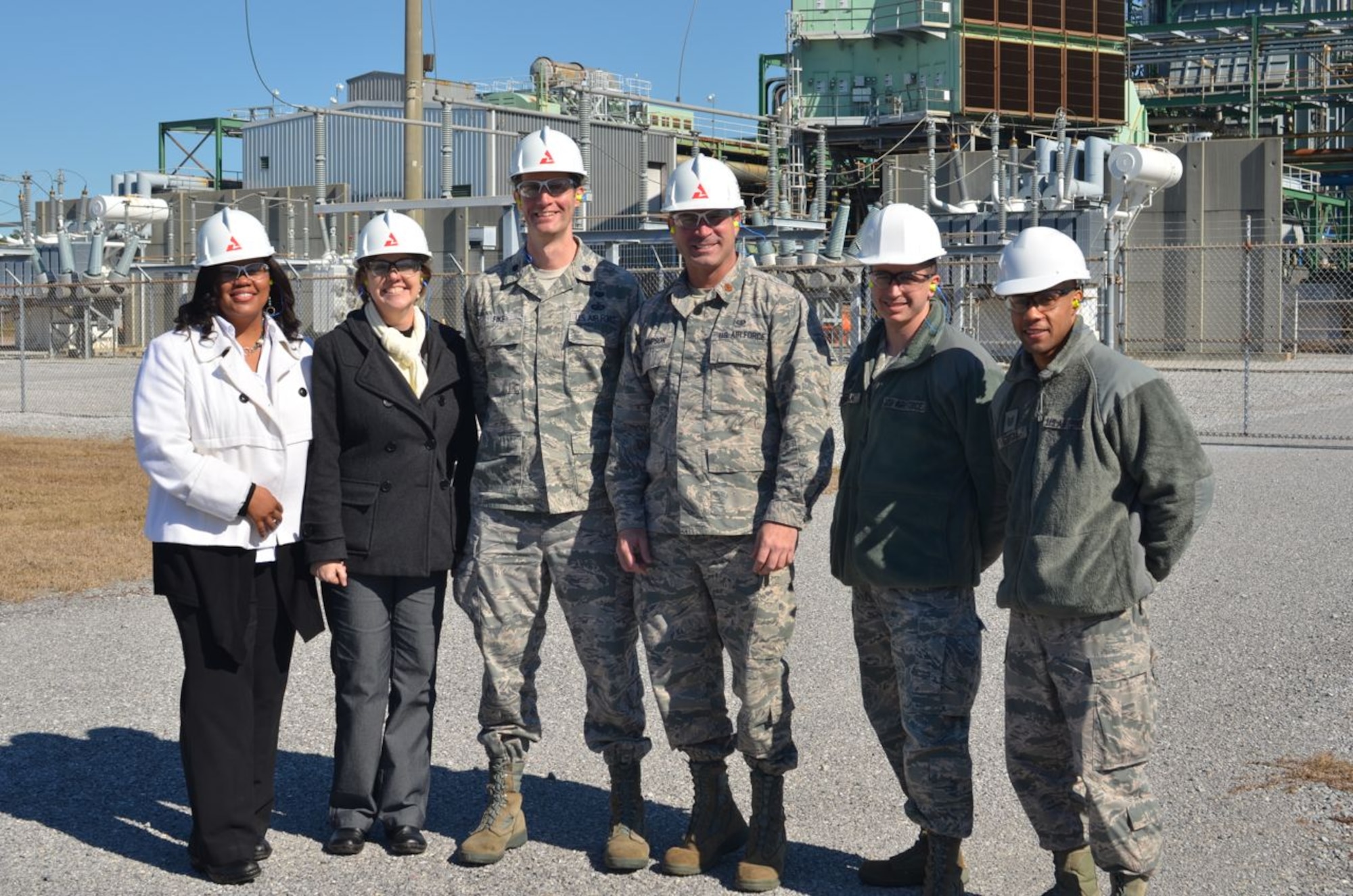 Members of the Utility Law Field Support Center, located at the Air Force
Civil Engineer Center's Tyndall Detachment, toured Gulf Power's Lansing
Smith generating plant in Bay County, Florida, last month. The ULFSC recently negotiated with Gulf Power to lower the utility company's requested base rate increase from $90.8 million to $55 million. Pictured left to right: Ebony Payton, paralegal; Karen White, attorney; Lt. Col. Gregg Fike, attorney; Maj. Chris Thompson, attorney; Capt. Drew Jernigan, attorney; Tech. Sgt. Toribio Garcia, paralegal. (U.S. Air Force photo/Jennifer McCabe)
