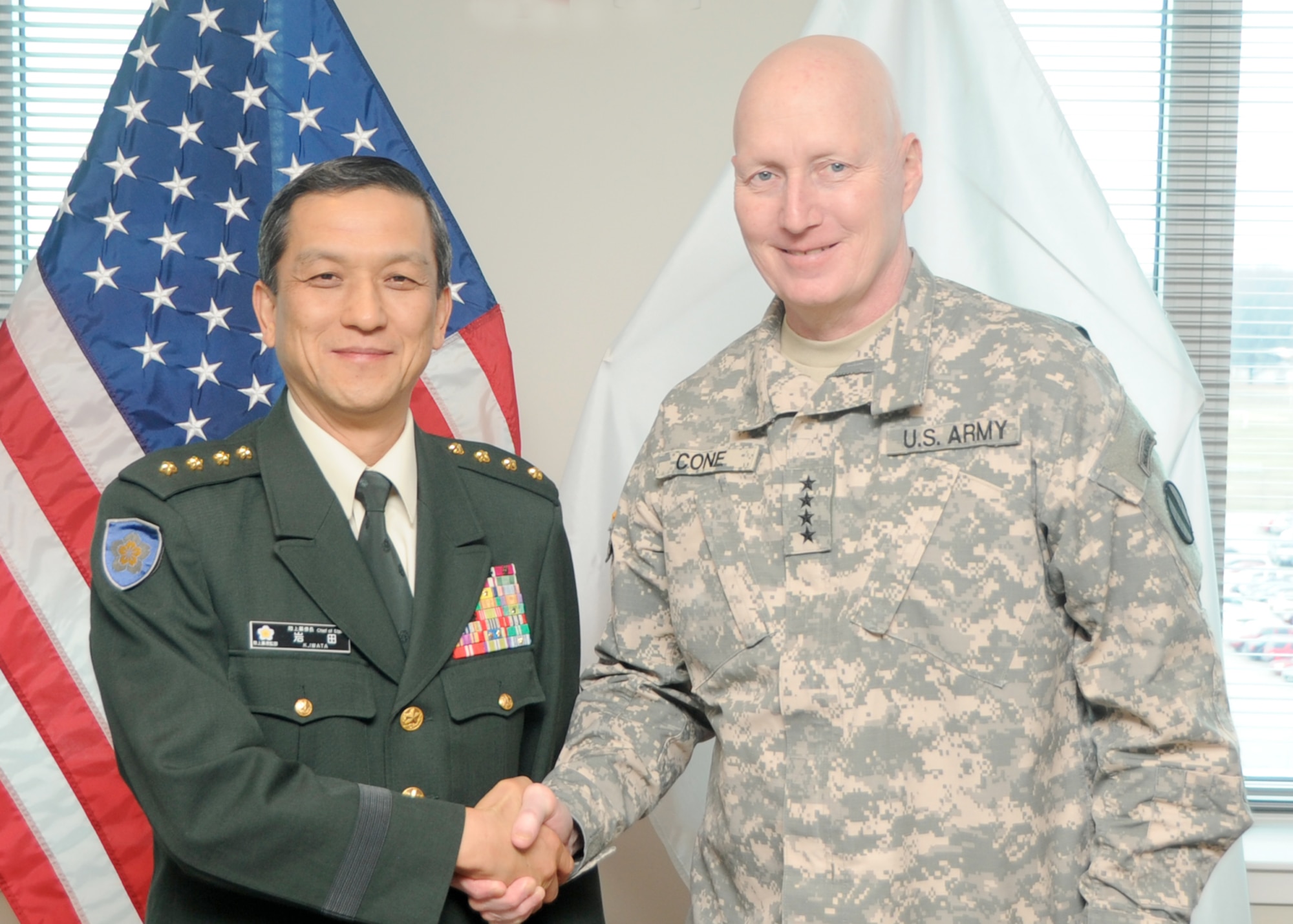 Gen. Kiyofumi Iwata, chief of staff of the Japan Ground Self-Defense Force,
stands with U.S. Army Gen. Robert W. Cone, commanding general of U.S. Army Training and Doctrine Command, during a visit to Joint Base Langley-Eustis, Va., Feb.
10. During the visit, Iwata met with TRADOC senior leadership to gain
understanding and perspectives of the roles and missions of TRADOC
headquarters and Initial Military Training. (U.S. Army photo by Staff Sgt.
Steven Schneider/Released)