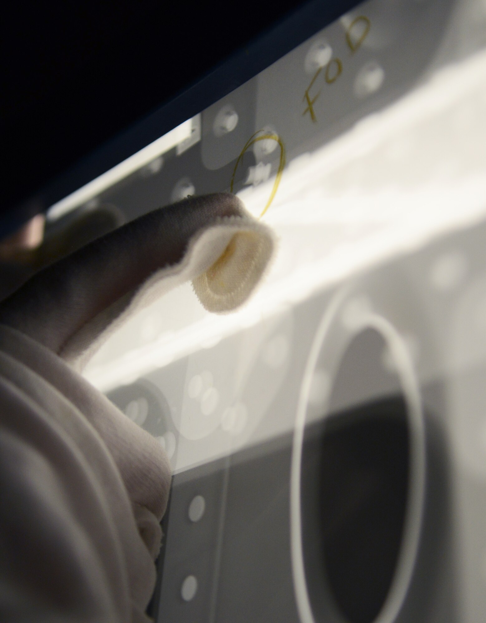 U.S. Air Force Tech. Sgt. Frank Castonguay, 100th Maintenance Squadron non-destructive inspection craftsman from Fort Walton Beach, Fla., inspects an X-ray Feb. 11, 2014, on RAF Mildenhall, England. The X-ray shows a misplaced rivet, which could potentially cause catastrophic damage over time. Performing X-rays of aircraft parts can lead to both life and money-saving repairs. (U.S. Air Force photo by Airman 1st Class Dillon Johnston/Released)