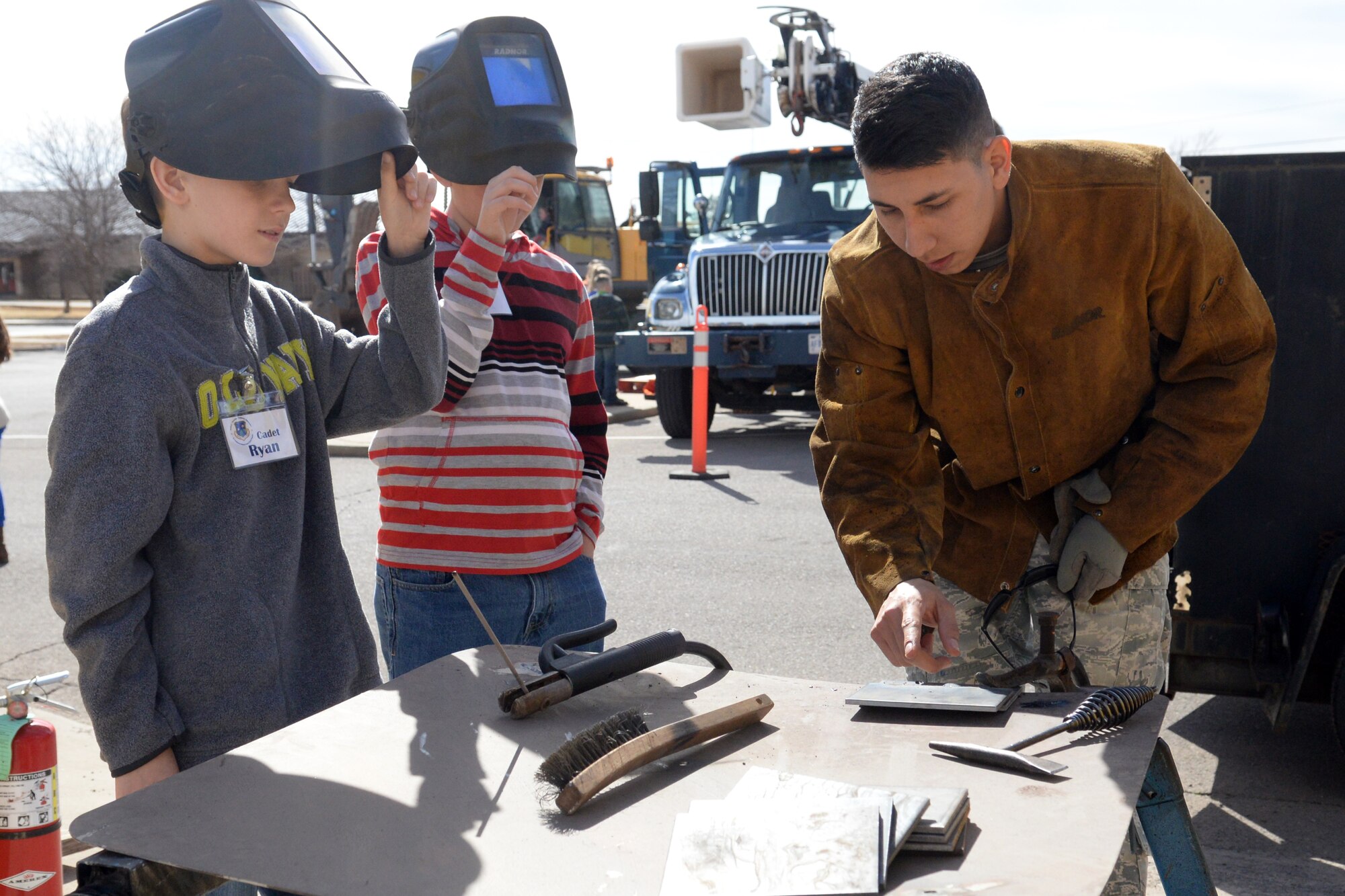 ALTUS AIR FORCE BASE, Okla. – A member of the 97th Civil Engineer Squadron structures flight demonstrates how to weld during a STEM tour for local students Feb. 18, 2014. The demonstration gave students a chance to see how science and technology play a role in building and maintaining structures pertaining to the mission. (U.S. Air Force photo by Senior Airman Dillon Davis/Released)