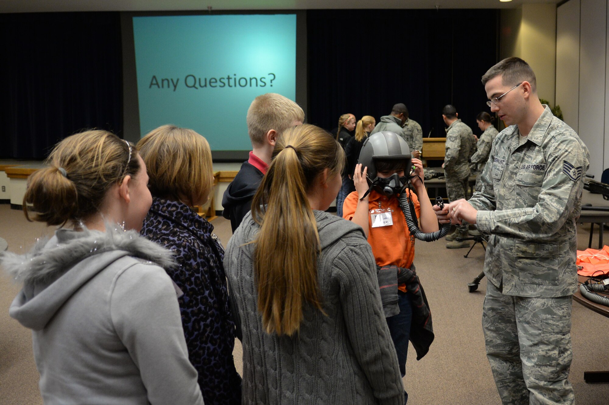 ALTUS AIR FORCE BASE, Okla. – U.S. Air Force Staff Sgt. Robert Whisenhunt, 97th Operations Support Squadron aircrew flight equipment technician, demonstrates to local students the importance of science and technology as it relates to maintaining and repairing aircrew equipment Feb. 18, 2014. The fifth graders from Hammon, Leedey and Mt. View-Gotebo Elementary Schools got an up-close look at what it takes to maintain a credible Air Force. (U.S. Air Force photo by Senior Airman Dillon Davis/Released)