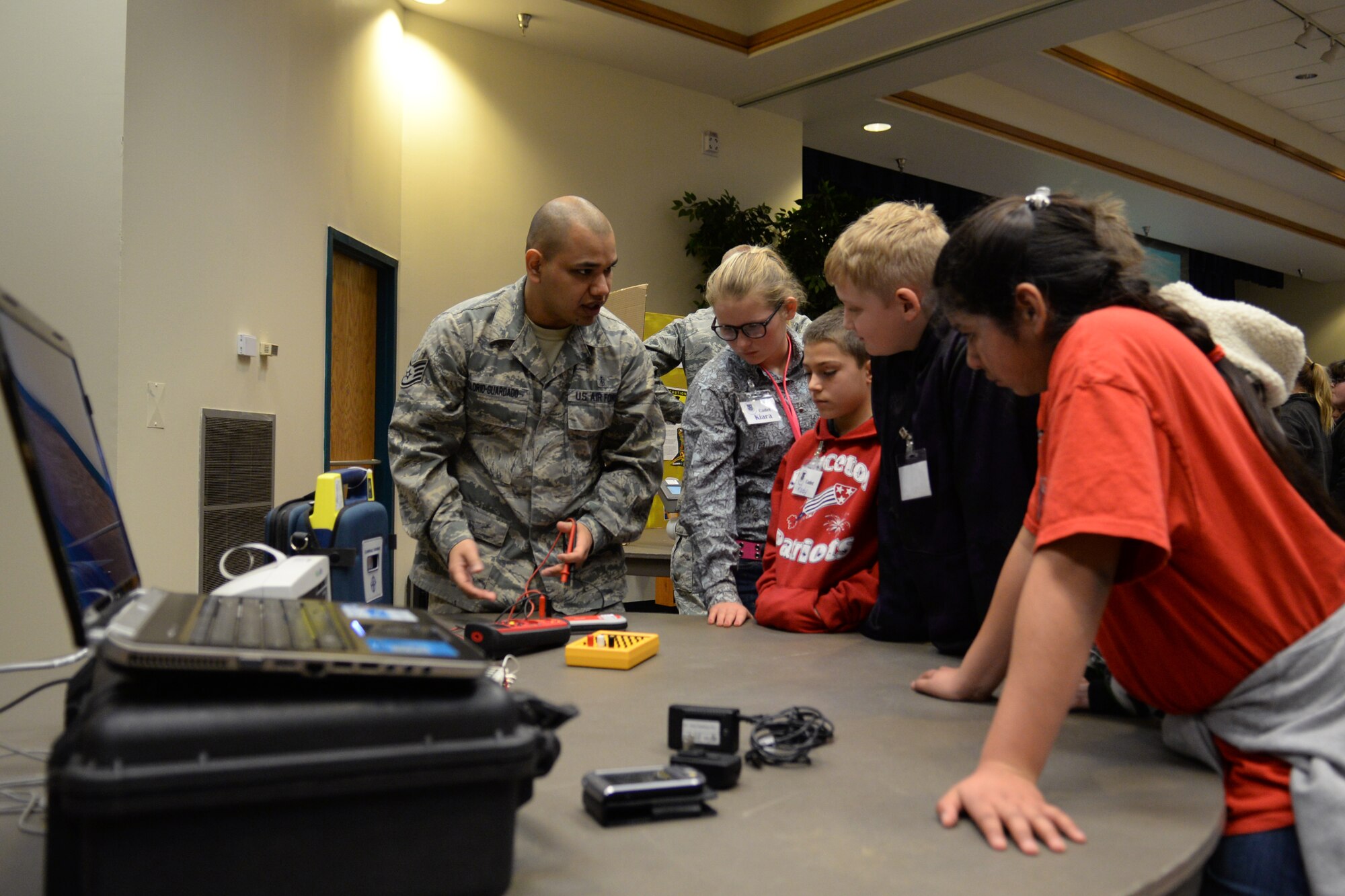 ALTUS AIR FORCE BASE, Okla. – U.S. Air Force Staff Sgt. Balmore Solorio-Guardado, 97th Medical Group biomedical equipment technician, explains to local students how he uses science and technology to maintain and repair medical equipment during a STEM tour Feb. 18, 2014. The tour provided fifth graders from Hammon, Leedey and Mt. View-Gotebo Elementary Schools a chance to learn and engage Airmen in science, technology, engineering and math career fields. (U.S. Air Force photo by Senior Airman Dillon Davis/Released)