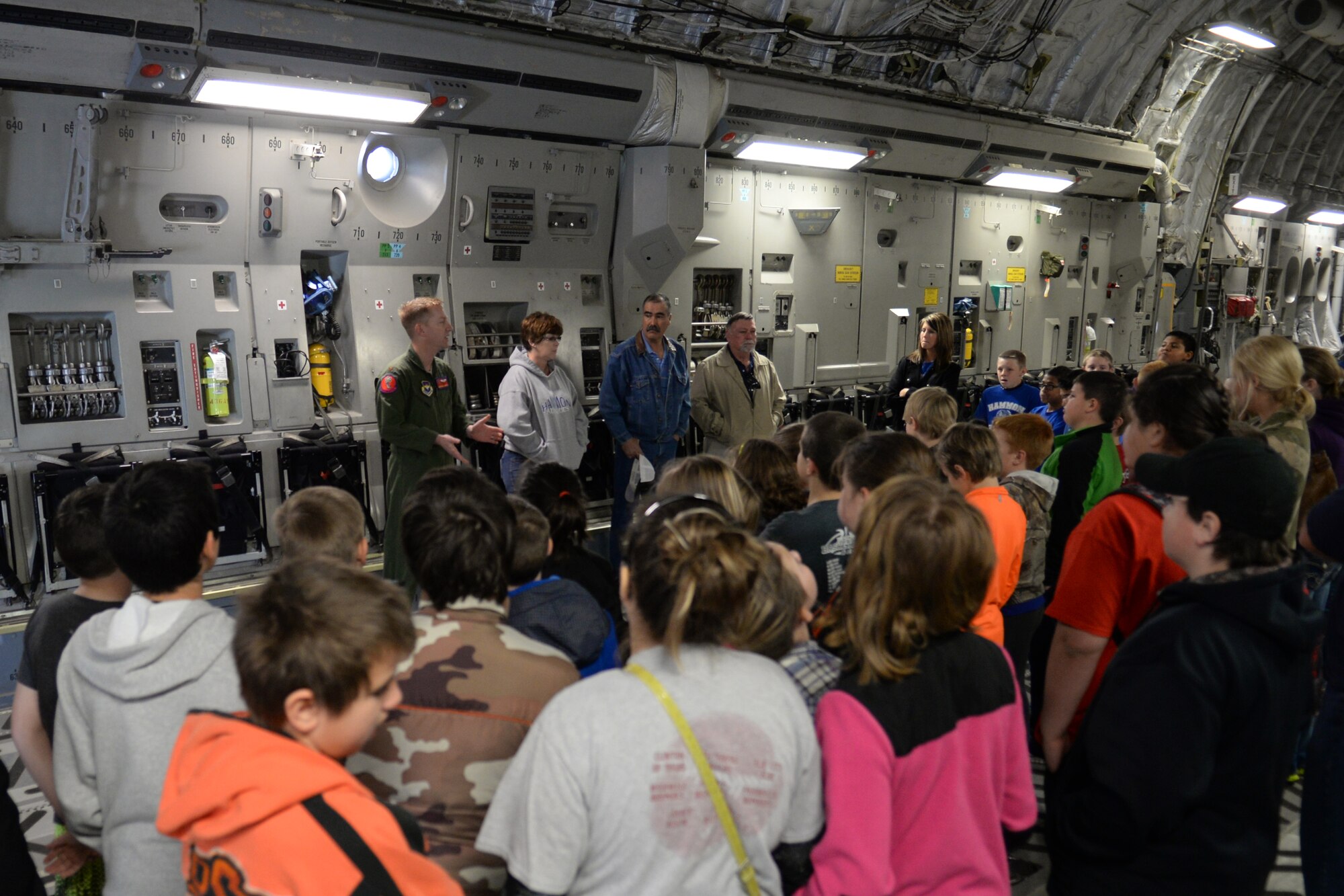 ALTUS AIR FORCE BASE, Okla. – U.S. Air Force Maj. Jon-Paul Griffin, 58th Airlift Squadron instructor pilot, talks to students from local schools about what it means to be a pilot Feb. 18, 2014. Paul-Griffin taught fifth graders from Hammon, Leedey and Mt. View-Gotebo Elementary Schools about how Airmen use science, technology, engineering and math to accomplish the mission. (U.S. Air Force photo by Senior Airman Dillon Davis/Released)