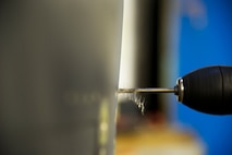 Airmen of the 5th Maintenance Squadron fabrication flight handle all aircraft assigned to Minot Air Force Base and schedules routine maintenance for each one. With Boeing no longer making many parts for the aging aircraft, the fabrication flight improvises and creates hand crafted solutions. (U.S. Air Force photo/Senior Airman Brittany Y. Auld)