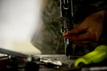 Senior Airman Jacob Pacheco, 5th Maintenance Squadron fabrication flight prepares his tools before preforming maintenance on a B-52H Stratofortress part at Minot Air Force Base, N.D. Airmen of the 5th Maintenance Squadron fabrication flight handle all aircraft assigned to Minot AFB. (U.S. Air Force photo/Senior Airman Brittany Y. Auld)