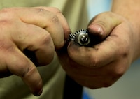 Airmen of the 5th Maintenance Squadron fabrication flight handle all aircraft assigned to Minot Air Force Base and schedules routine maintenance for each one. With Boeing no longer making many parts for the aging aircraft, the fabrication flight improvises and creates hand crafted solutions. (U.S. Air Force photo/Senior Airman Brittany Y. Auld)