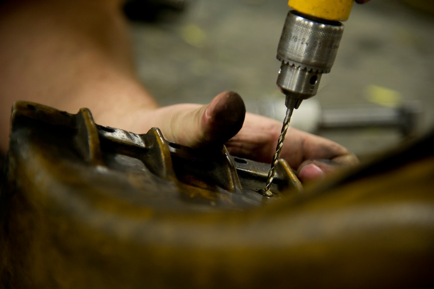 Airmen of the 5th Maintenance Squadron fabrication flight handle all aircraft assigned to Minot Air Force Base and schedules routine maintenance for each one. With Boeing no longer making many parts for the aging aircraft, the fabrication flight improvises and creates hand crafted solutions. (U.S. Air Force photo/Senior Airman Brittany Y. Auld)