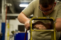 Airmen of the 5th Maintenance Squadron fabrication flight handle all aircraft assigned to Minot Air Force Base and schedules routine maintenance for each one. With Boeing no longer making many parts for the aging aircraft, the fabrication flight improvises and creates hand crafted solutions. (U.S. Air Force photo/Senior Airman Brittany Y. Auld)