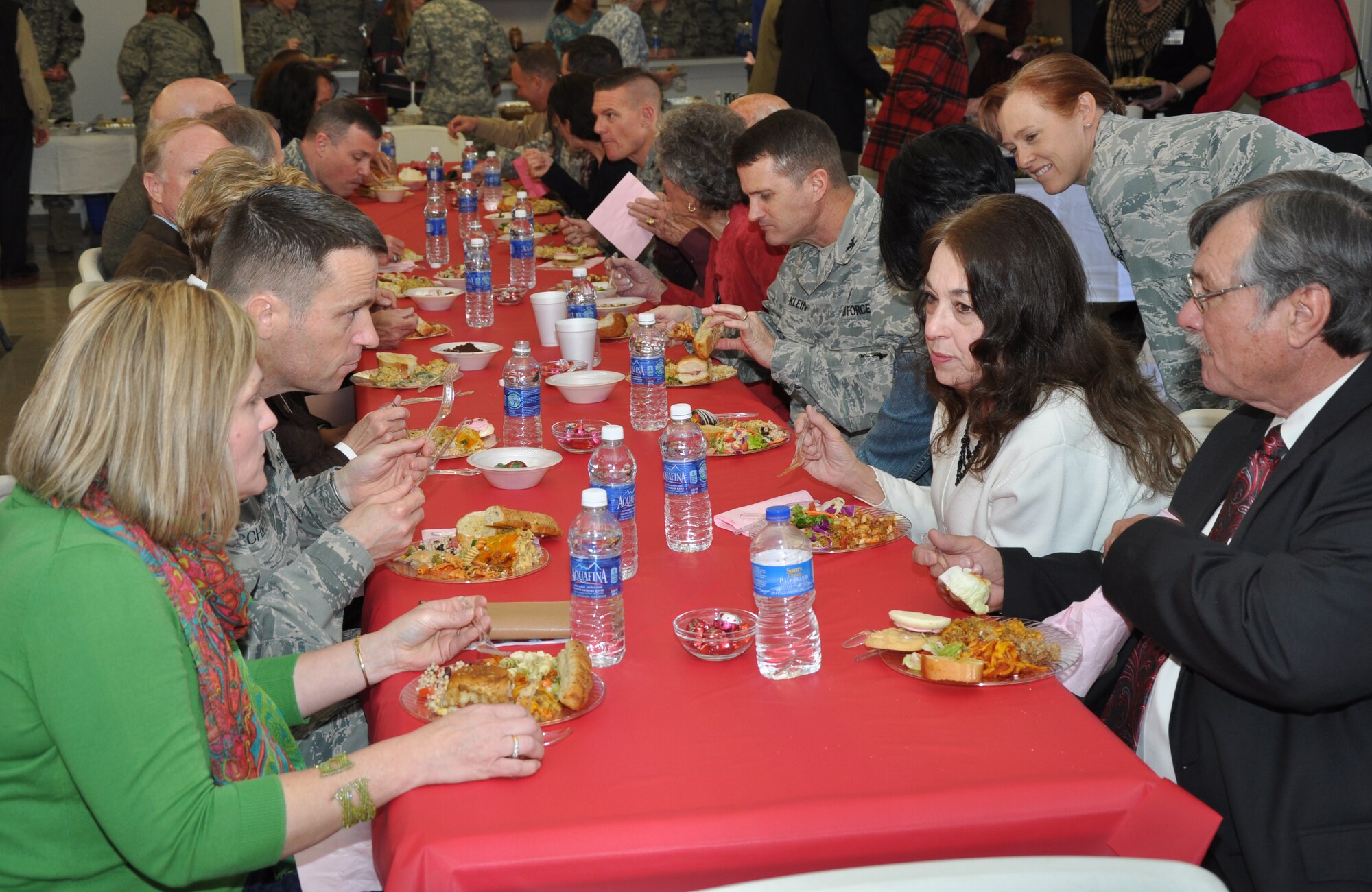 GOODFELLOW AIR FORCE BASE, Texas – The San Angelo Mayor Dwain Morrison talks with Col. Thomas Schmidt, 17th Training Wing Vice Commander, at the National Prayer Luncheon in the Taylor Chapel here Feb. 14. Morrison and Goodfellow members ate lunch, after base leaders prayed on topics important to the base including students and deployed members. (U.S. Air Force photo/ Senior Airman Joshua Edwards)