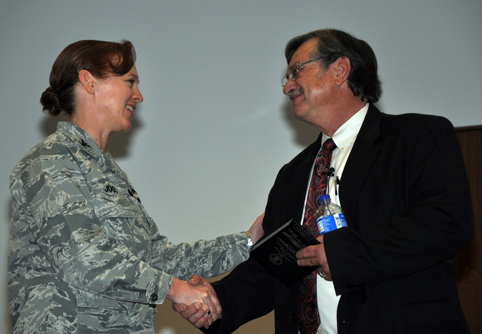 GOODFELLOW AIR FORCE BASE, Texas - Col. Kimberlee Joos, 17th Training Wing Commander, presents the San Angelo Mayor Dwain Morrison with a token of appreciation for speaking at the National Prayer Luncheon in the Taylor Chapel here Feb. 14. Morrison spoke about a variety of topics such as having a happy marriage and determination. (U.S. Air Force photo/ Senior Airman Joshua Edwards)