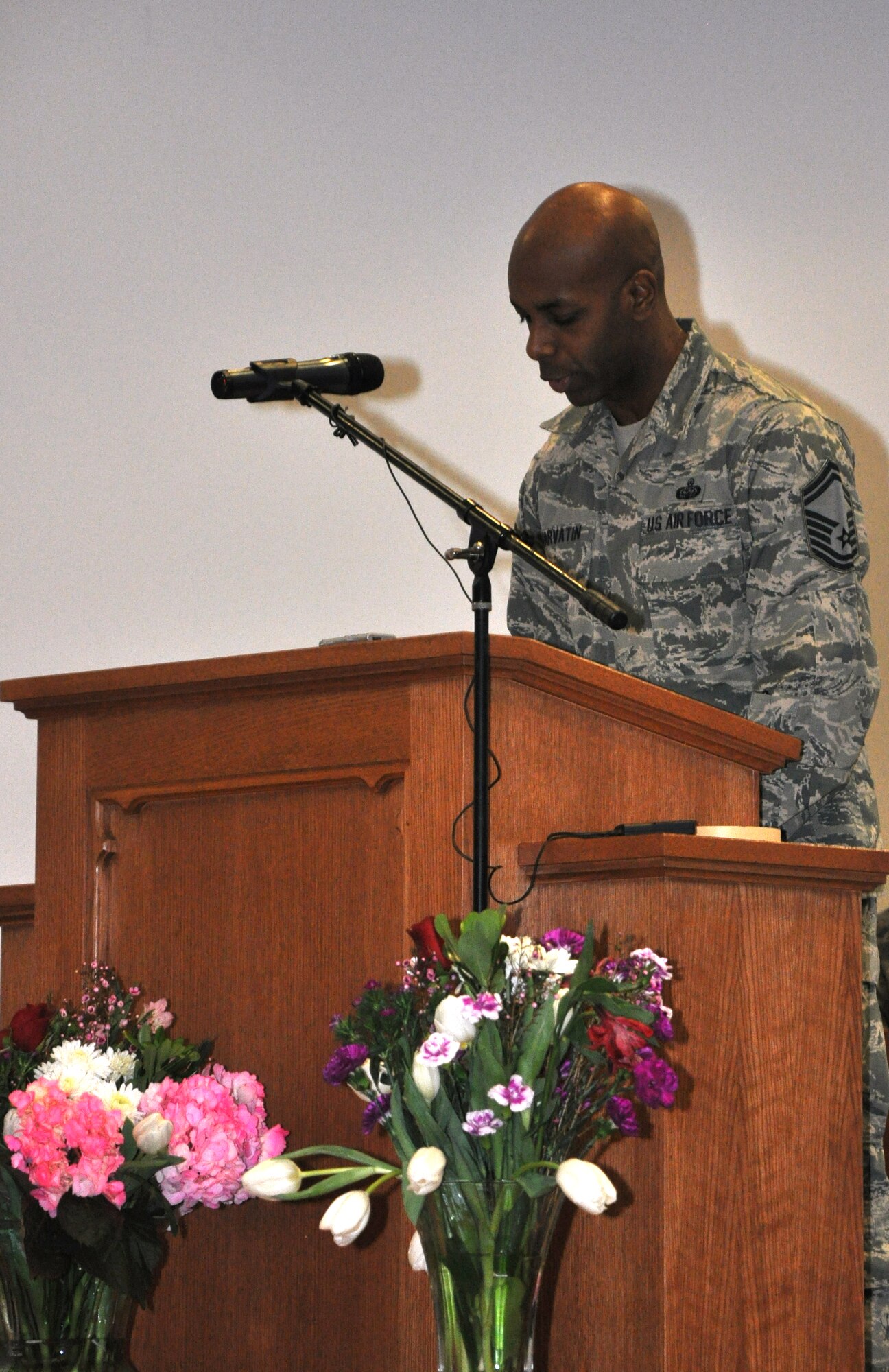 GOODFELLOW AIR FORCE BASE, Texas - Senior Master Sgt. David Harvatin, 17th Training Wing Special Plans and Programs superintendent and Knowledge Operation manager, prays for the Goodfellow students at the National Prayer Luncheon in the Taylor Chapel here Feb. 14. Harvatin and other speakers prayed for families, service members and other aspects of their lives. (U.S. Air Force photo/ Senior Airman Joshua Edwards)