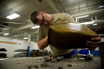 Airmen of the 5th Maintenance Squadron fabrication flight handle all aircraft assigned to Minot Air Force Base and schedules routine maintenance for each one. With Boeing no longer making many parts for the aging aircraft, the fabrication flight improvises and creates hand crafted solutions. Some of the tasks the fabrication flight perform are: welding, engine repair, painting, machine work, searching for cracks and damaged parts, rivet work, creating screws and bolts, and even doing work for the 54th Helicopter Squadron. (U.S. Air Force photo/Senior Airman Brittany Y. Auld)