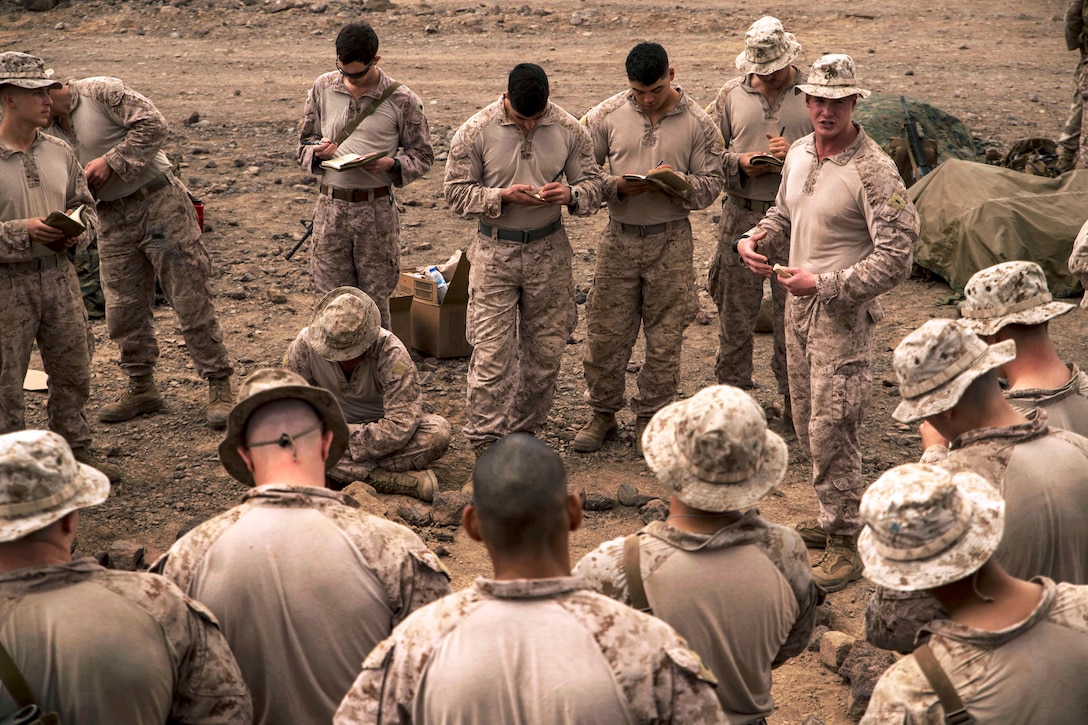 U.S. Marines receive a briefing before a platoon assault exercise on Arta Range, Djibouti, Feb. 10, 2014. The Marines are assigned to Alpha Company, 13th Marine Expeditionary Unit. The unit is deployed with the Boxer Amphibious Ready Group as a theater reserve and crisis response force throughout the U.S. 5th Fleet area of responsibility.
