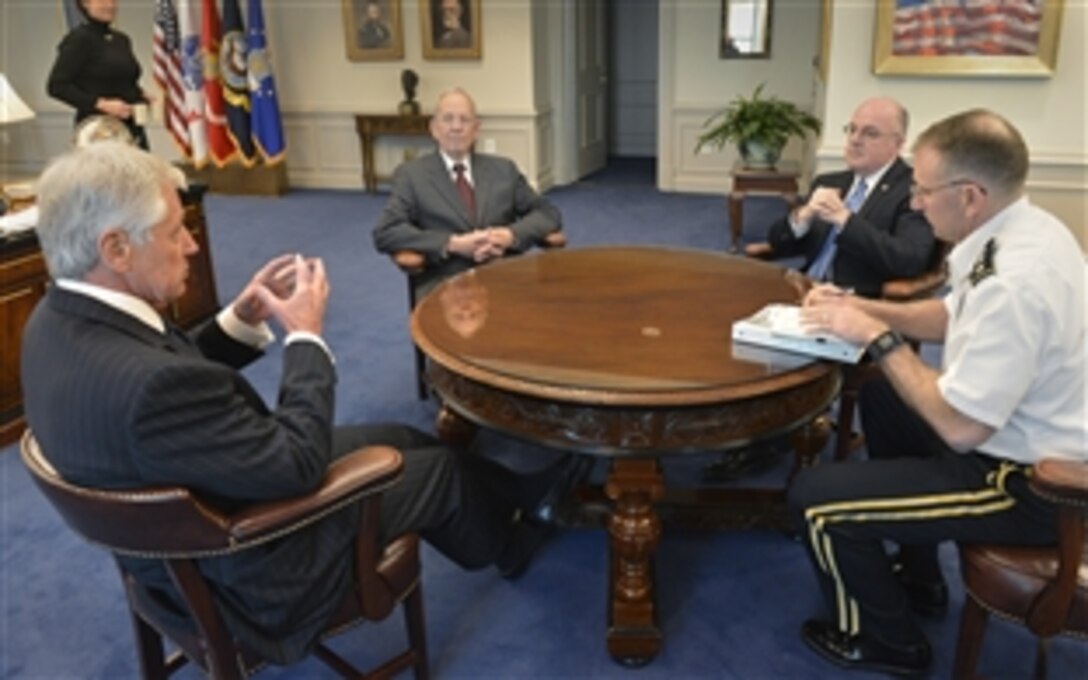 Defense Secretary Chuck Hagel, left, meets with retired Air Force Gen. Larry D. Welch, second from left, and retired Navy Adm. John C. Harvey Jr., second from right, at the Pentagon, Feb. 19, 2014. Welch and Harvey will begin an independent review of the Defense Department's nuclear enterprise to correspond with an internal review, responding to revelations of irregularities within the nuclear enterprise. Army Lt. Gen. Robert B. Abrams, the secretary's senior military assistant, sits right.