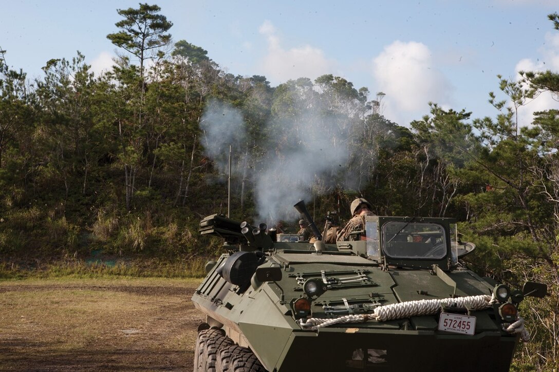 Marines with Light Armored Reconnaissance Company fire light armored vehicle-mounted mortars Feb. 11 during mortar live-fire training at the Central Training Area near Camp Hansen. The LAV-mortar variant is an amphibious reconnaissance vehicle designed for mobile-armored enemy suppression. LAR Company is part of Combat Assault Battalion, 3rd Marine Division, III Marine Expeditionary Force. Photo by Lance Cpl. Cedric R. Haller II