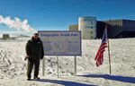 U.S. Air Force Col. Steven S. Norris, 182nd Medical Group commander, stands at the South Pole during his deployment to McMurdo Station, Antarctica, Nov. 21, 2013.
