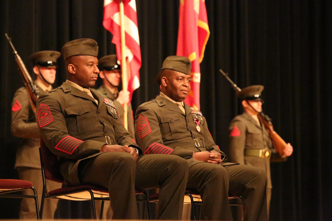 Sgts. Maj. Gerald Saunders and Michael Moore listen to Col. Robin Gallant, Headquarters and Service Battalion commanding officer, during a relief and appointment ceremony at Little Hall on Feb. 19, 2014. Saunders assumed his current duties as H&S Bn. sergeant major after completing a tour at a recruiting station in Albany, N.Y.