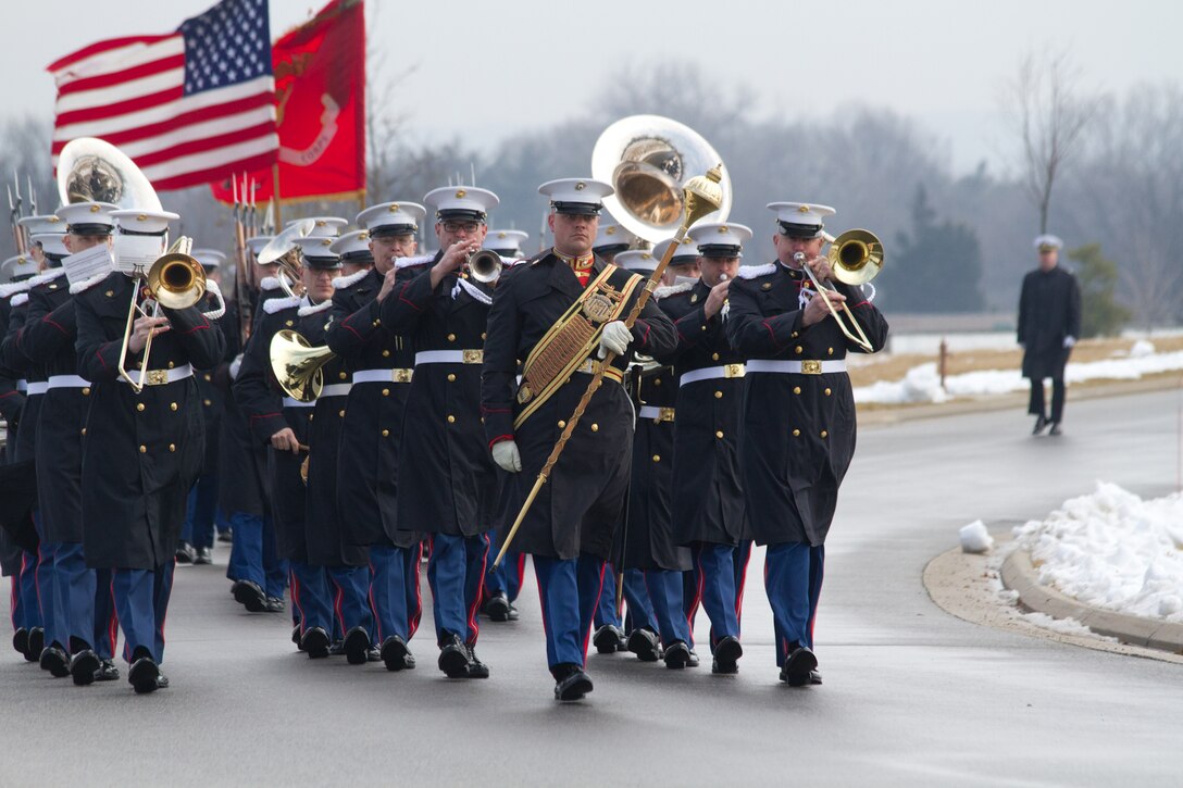 On Feb. 19, 2014, the Marine Band participated in the funeral for Colonel Charles Waterhouse, USMC (Ret.) at Arlington National Cemetery. Col. Waterhouse was the first and only artist-in-residence of the U.S. Marine Corps. On Feb. 19, 1945, Col. Waterhouse was seriously wounded during the first wave at Iwo Jima. Following the war, he graduated from Newark School of Fine and Industrial Arts. He stayed on at the school as a teacher and spent the next 28 years building a reputation as an illustrator for publications such as Outdoor Life, Reader's Digest, Rutgers Press and the Boy Scouts. Three tours of duty as a combat artist in Vietnam resulted in hundreds of on-the-spot drawings that were later turned into one large volume called Delta to DMZ. In 1973, Col. Waterhouse was brought back to active duty at the rank of major to create a series of 14 paintings of the Marines in the Revolution in celebration of the bicentennial. He retired on Feb. 19, 1991. (U.S. Marine Corps photo by Gunnery Sgt. Amanda Simmons/released)
