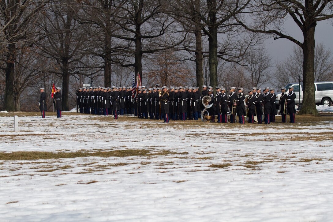 On Feb. 19, 2014, the Marine Band participated in the funeral for Colonel Charles Waterhouse, USMC (Ret.) at Arlington National Cemetery. Col. Waterhouse was the first and only artist-in-residence of the U.S. Marine Corps. On Feb. 19, 1945, Col. Waterhouse was seriously wounded during the first wave at Iwo Jima. Following the war, he graduated from Newark School of Fine and Industrial Arts. He stayed on at the school as a teacher and spent the next 28 years building a reputation as an illustrator for publications such as Outdoor Life, Reader's Digest, Rutgers Press and the Boy Scouts. Three tours of duty as a combat artist in Vietnam resulted in hundreds of on-the-spot drawings that were later turned into one large volume called Delta to DMZ. In 1973, Col. Waterhouse was brought back to active duty at the rank of major to create a series of 14 paintings of the Marines in the Revolution in celebration of the bicentennial. He retired on Feb. 19, 1991. (U.S. Marine Corps photo by Gunnery Sgt. Amanda Simmons/released)