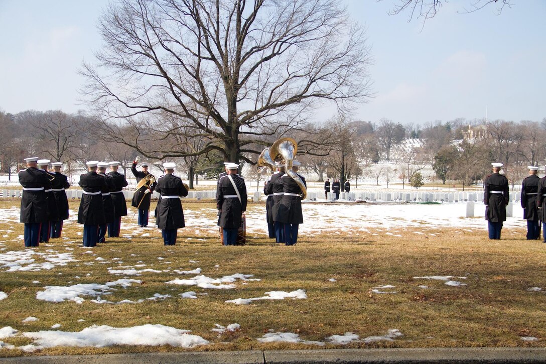 On Feb. 19, 2014, the Marine Band participated in the funeral for Colonel Charles Waterhouse, USMC (Ret.) at Arlington National Cemetery. Col. Waterhouse was the first and only artist-in-residence of the U.S. Marine Corps. On Feb. 19, 1945, Col. Waterhouse was seriously wounded during the first wave at Iwo Jima. Following the war, he graduated from Newark School of Fine and Industrial Arts. He stayed on at the school as a teacher and spent the next 28 years building a reputation as an illustrator for publications such as Outdoor Life, Reader's Digest, Rutgers Press and the Boy Scouts. Three tours of duty as a combat artist in Vietnam resulted in hundreds of on-the-spot drawings that were later turned into one large volume called Delta to DMZ. In 1973, Col. Waterhouse was brought back to active duty at the rank of major to create a series of 14 paintings of the Marines in the Revolution in celebration of the bicentennial. He retired on Feb. 19, 1991. (U.S. Marine Corps photo by Gunnery Sgt. Amanda Simmons/released)