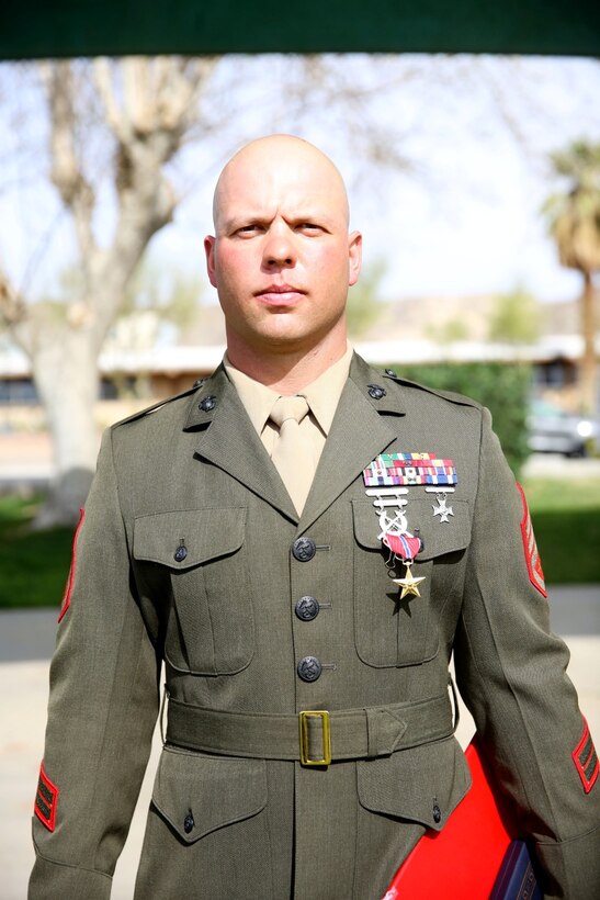 Staff Sgt. Joshua Brodrick, a platoon sergeant with 1st Battalion, 7th Marine Regiment, received the Bronze Star Medal with combat V for valor from Lt. Gen. John Toolan, commanding general of I Marine Expeditionary Force, during an award ceremony held at Marine Corps Air Ground Combat Center Twentynine Palms, Calif., Feb. 18, 2014. Brodrick, a native of Huntington, Ind., was recognized for his heroic actions in Afghanistan when he maintained a tactical advantage while being ambushed by a larger enemy force. He saved the lives of multiple Marines during the six-day operation. (U.S. Marine