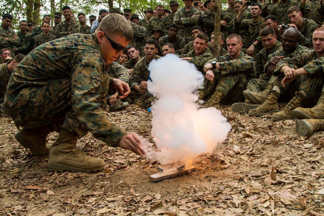 A U.S. Marine uses brake fluid from a vehicle and gunpowder from a 5.56 round to create a fire during a jungle survival class Feb. 14 at Ban Chan Krem, Kingdom of Thailand during Exercise Cobra Gold. Cobra Gold demonstrates the U.S. and the Kingdom of Thailand’s commitment to a longs-standing alliance and regional partnership, prosperity and security in the Asia-Pacific region. Marines are with 3rd Battalion, 1st Marine Regiment currently assigned to 3rd Marine Division, III Marine Expeditionary Force under the unit deployment program. (U.S. Marine photo by Lance Cpl. Stephen D. Himes/Released)