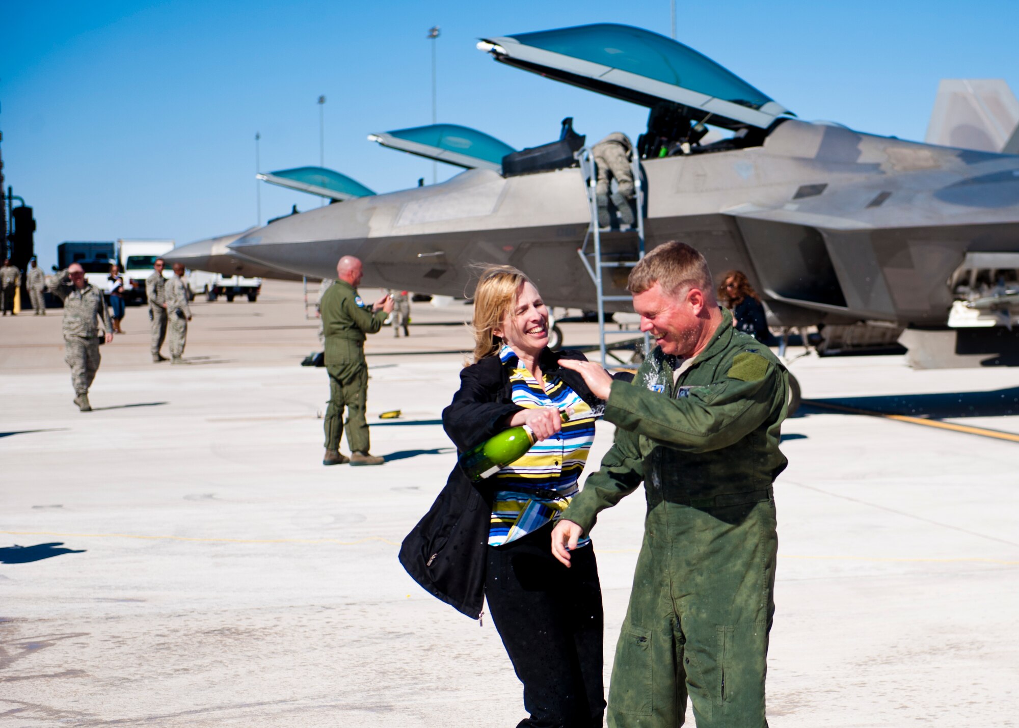 Colonel Andrew Croft, 49th Wing commander, celebrates with his wife, Vicki Croft, after his final flight in the F-22 Raptor at Holloman Ai Force Base, N.M., Feb. 20. The 7th Fighter Squadron and members of the Holloman community celebrated this sortie before the F-22s depart for Tyndall Air Force Base, Fla., in early April. (U.S. Air Force photo by Airman 1st Class Daniel Liddicoet/Released)