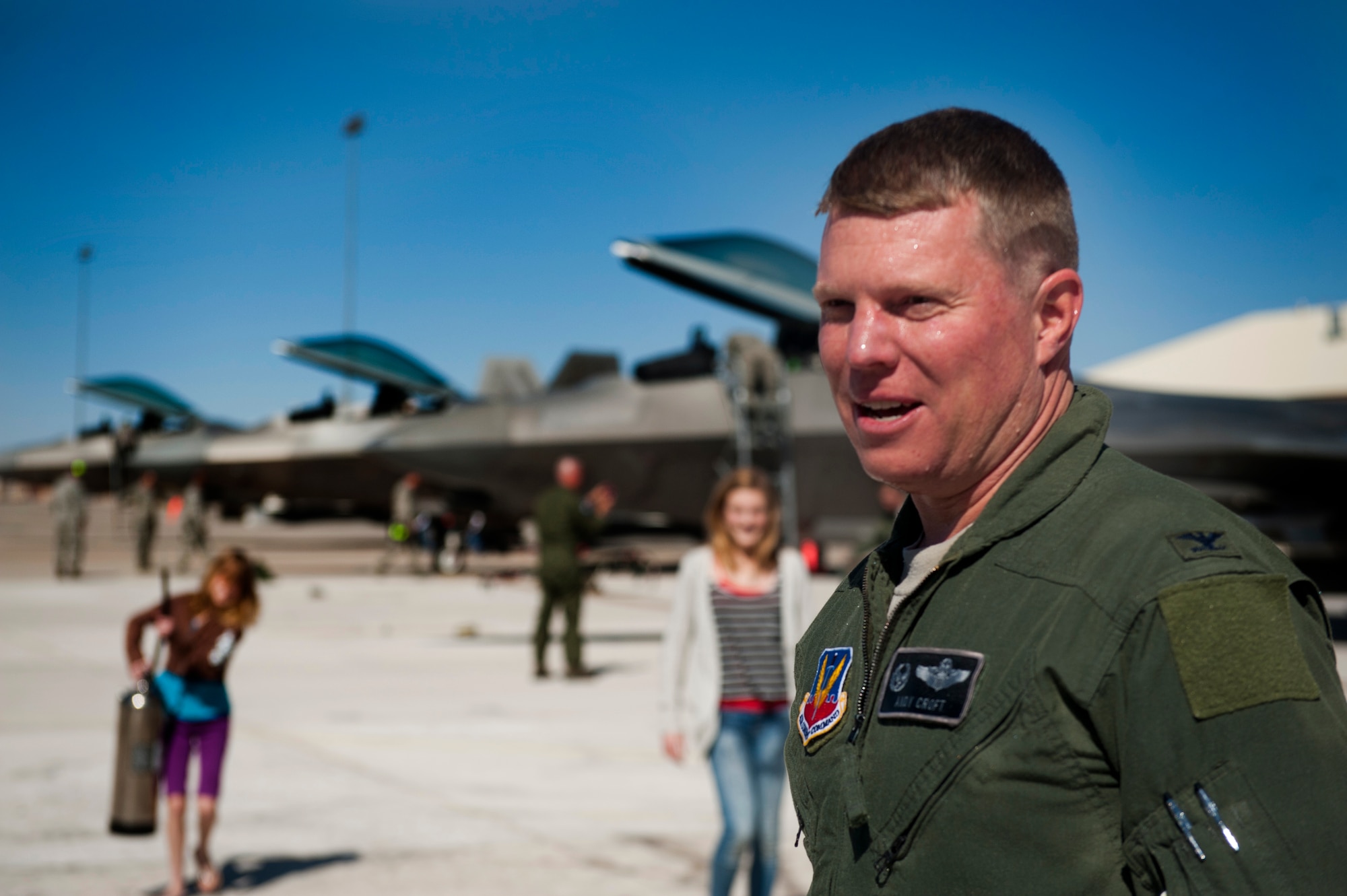 Colonel Andrew Croft, 49th Wing commander, greets his visitors after finishing his final flight in the F-22 Raptor at Holloman Air Force Base, N.M., Feb. 20. The 7th Fighter Squadron and members of the Holloman community celebrated this sortie before the F-22s depart for Tyndall Air Force Base, Fla., in early April. (U.S. Air Force photo by Airman 1st Class Aaron Montoya / Released)