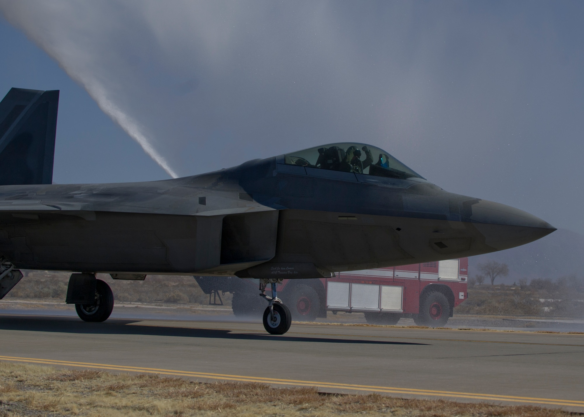An F-22 Raptor prepares to land at Holloman Air Force Base N.M., after completing the final four-ship tactical sortie over the Tularosa Basin Feb. 20. The 7th Fighter Squadron and members of the Holloman community celebrated this final sortie before the F-22s depart for Tyndall Air Force Base, Fla., in early April. (U.S. Air Force photo by Airman 1st Class Chase Cannon/Released)