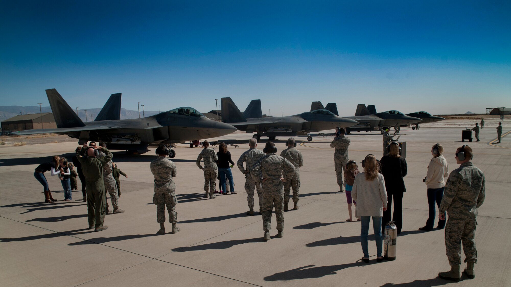 Four F-22 Raptors park after flying their final four-ship tactical sortie at Holloman Air Force Base, N.M., Feb. 20. The 7th Fighter Squadron and members of the Holloman community celebrated this sortie before the F-22s depart for Tyndall Air Force Base, Fla., in early April. (U.S. Air Force photo by Airman 1st Class Aaron Montoya / Released)