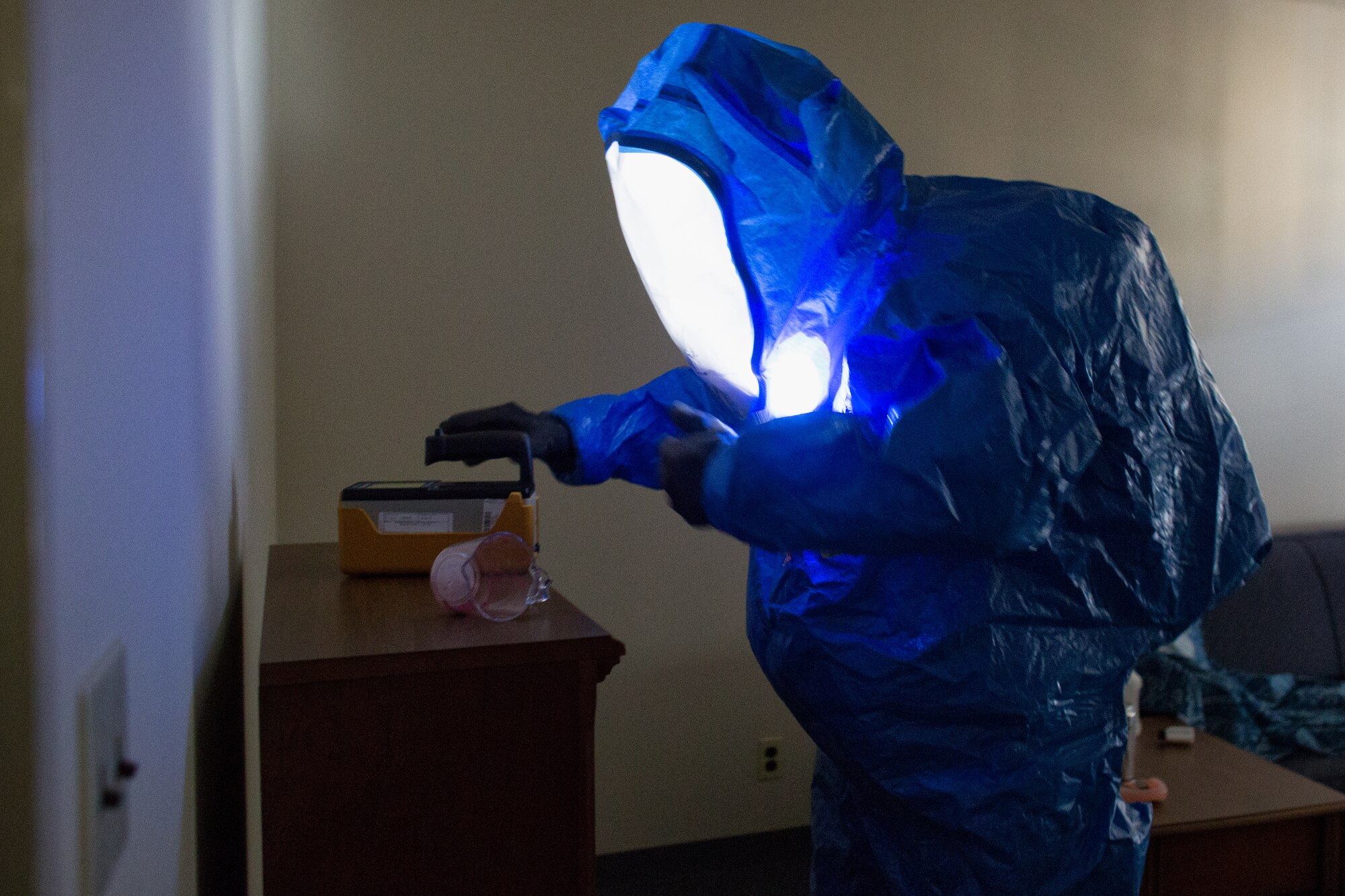 Staff Sgt. Wesley Barlow, 374th Aerospace Medicine Squadron bioenvironmental engineering technician, conducts a field test on a simulated unknown substance during a hazardous material training exercise at Yokota Air Base, Japan, Feb. 20, 2014. The primary purpose of the exercise was joint crime scene preservation training among emergency management, bioenvironmental engineers, fire department, security forces, medical technicians, and Air Force Office of Special Investigations to ensure minimal scene disturbance while completing presumptive identification, sampling and evidence collection. (U.S. Air Force photo by Osakabe Yasuo/Released)