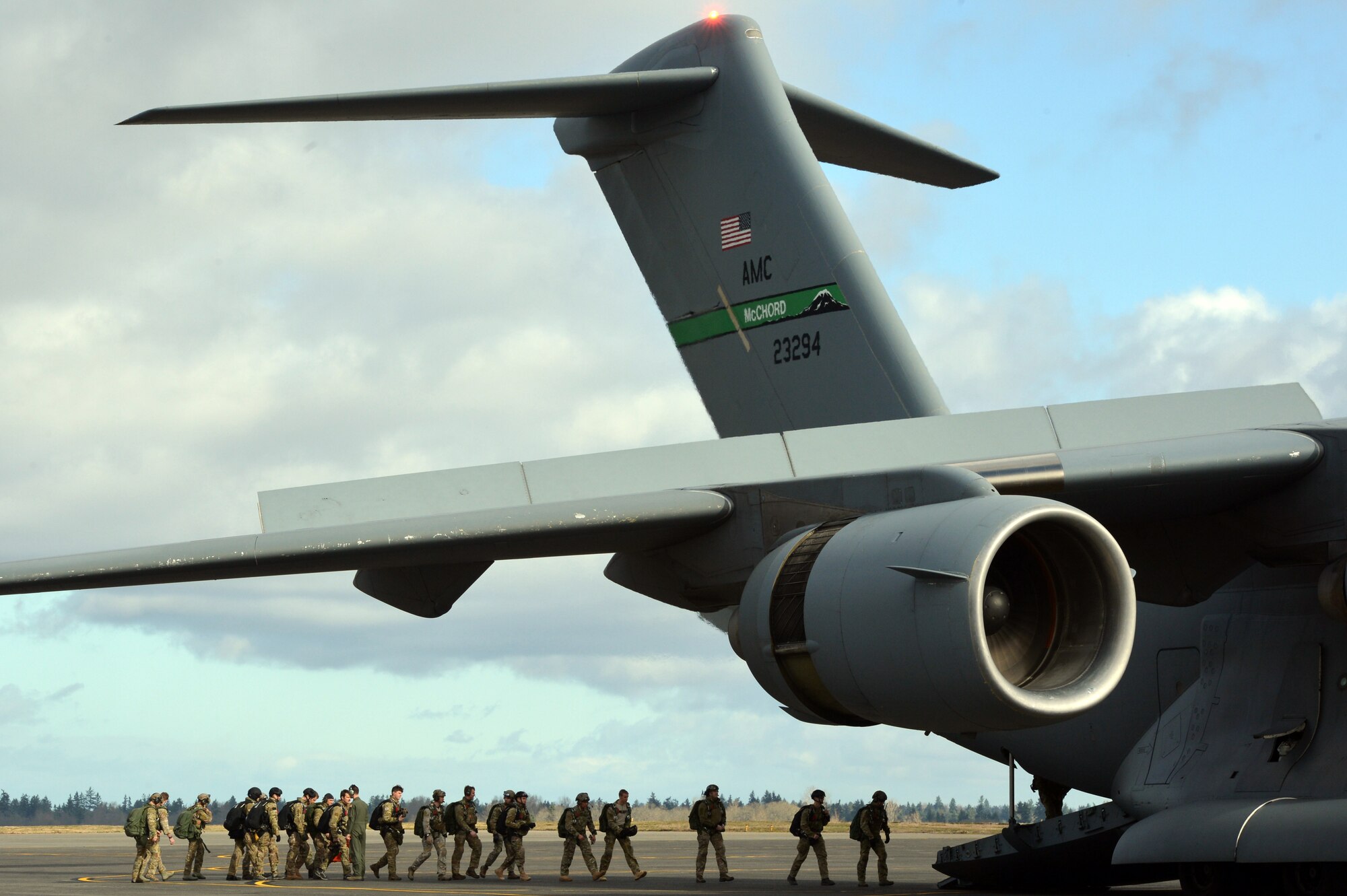 Members of the 22nd Special Tactics Squadron load onto a C-17 Globemaster III, Feb. 12, 2014, to practice high altitude, low opening parachute jumping at Joint Base Lewis-McChord, Wash. The jumpers performed three HALO jumps and two static line jumps. (U.S. Air Force photo/Staff Sgt. Russ Jackson)