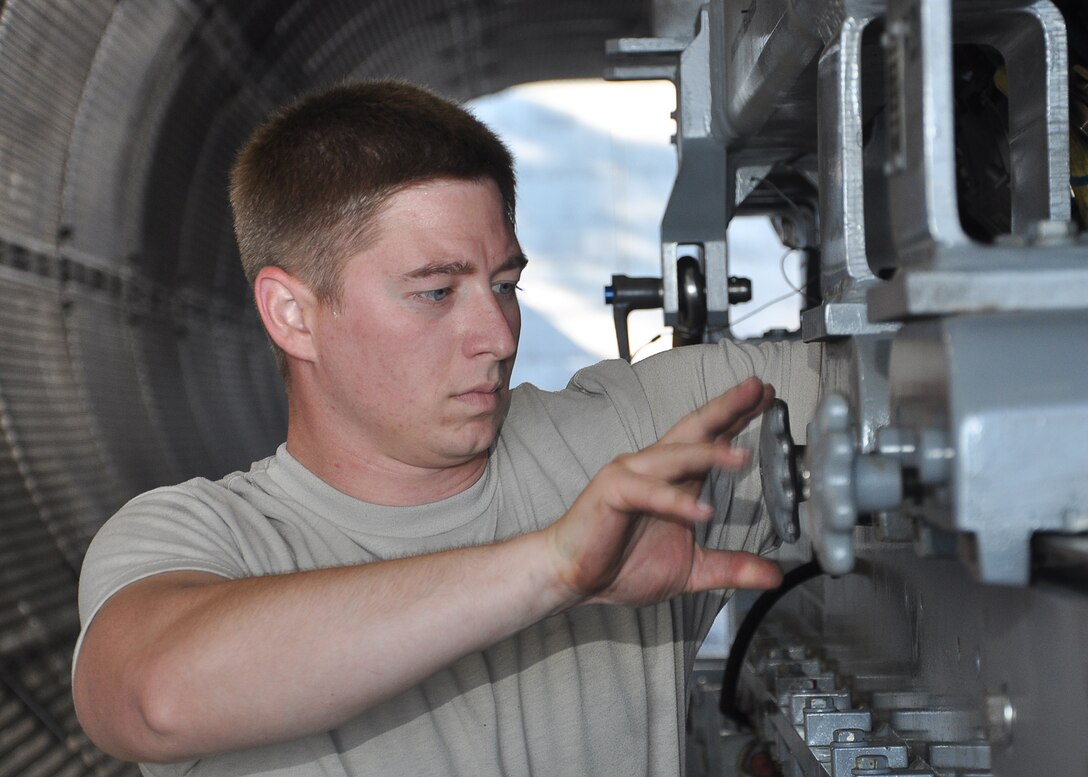 Senior Airman Vernon Foster, 325th Maintenance Squadron engine specialist, sets an F-119 F-22 Raptor engine Feb. 20 at the Test Cell in preparation for an indoor test of the engine. (U.S. Air Force photo by Airman 1st Class Solomon Cook)