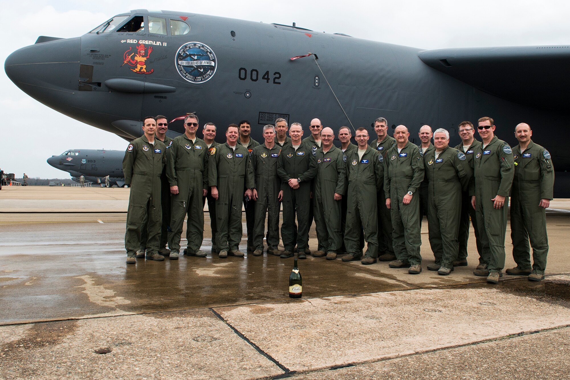 A group of 20 aircrew members reached a milestone in the B-52H Stratofortress by flying a two-ship mission with a combined total of over 100,000 flying hours, Feb. 18, 2014, Barksdale Air Force Base, La. The mission also marked the last flight for Col. Joseph Jones (center), 307th Bomb Wing vice commander, who is retiring from the Air Force Reserve after 37 years of military service. (U.S. Air Force photo by Master Sgt. Greg Steele/Released)