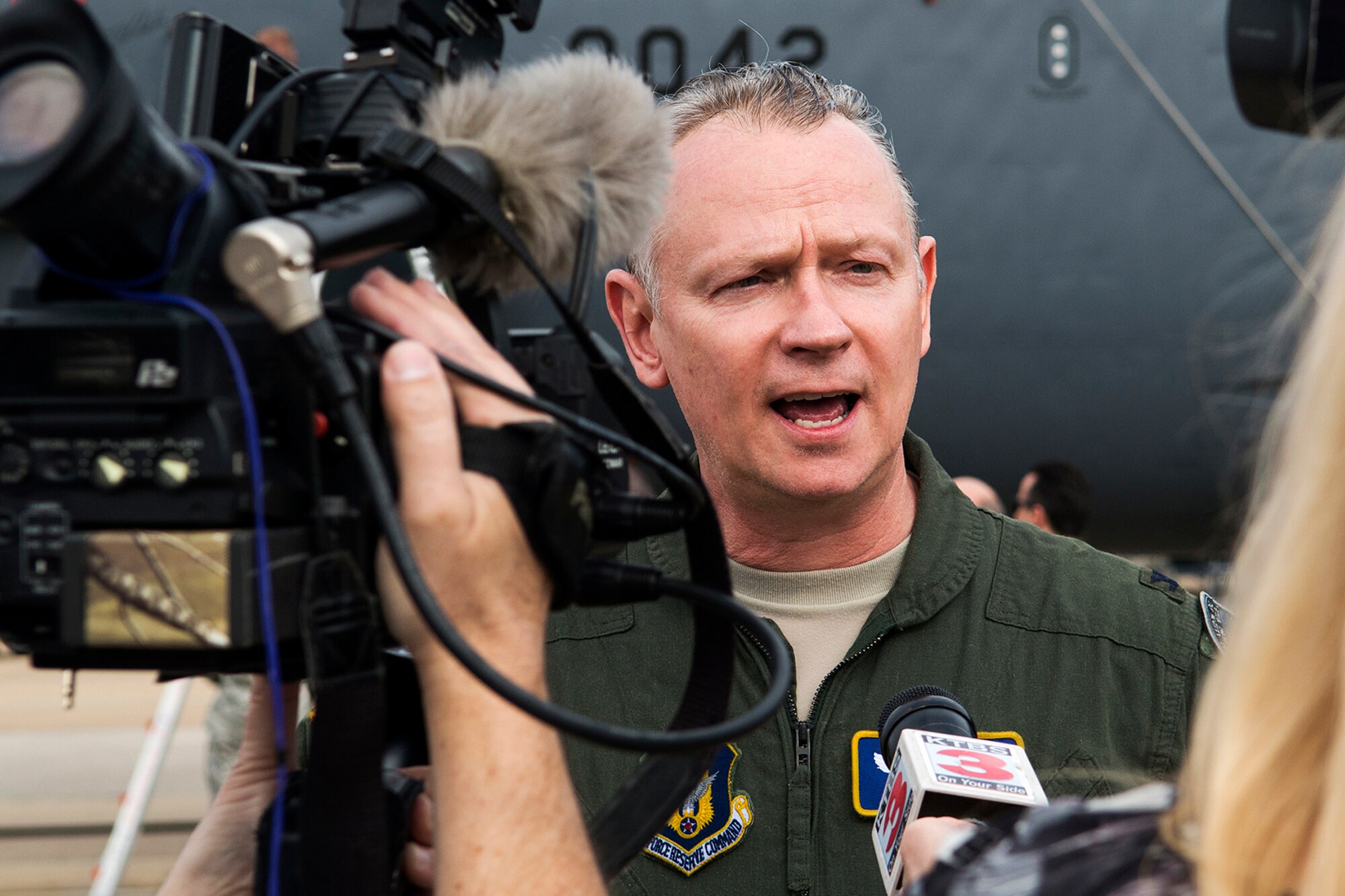 U.S. Air Force Col. Joseph Jones, 307th Bomb Wing vice commander, is interviewed by local media following a mission in a B-52H Stratofortress, Feb. 18, 2014, Barksdale Air Force Base, La. The mission consisted of two B-52s flying with aircrews totaling over 100,000 combined flying hours and it also was the last flight for Jones, who is retiring from the Air Force Reserve after 37 years of military service. (U.S. Air Force photo by Master Sgt. Greg Steele/Released)