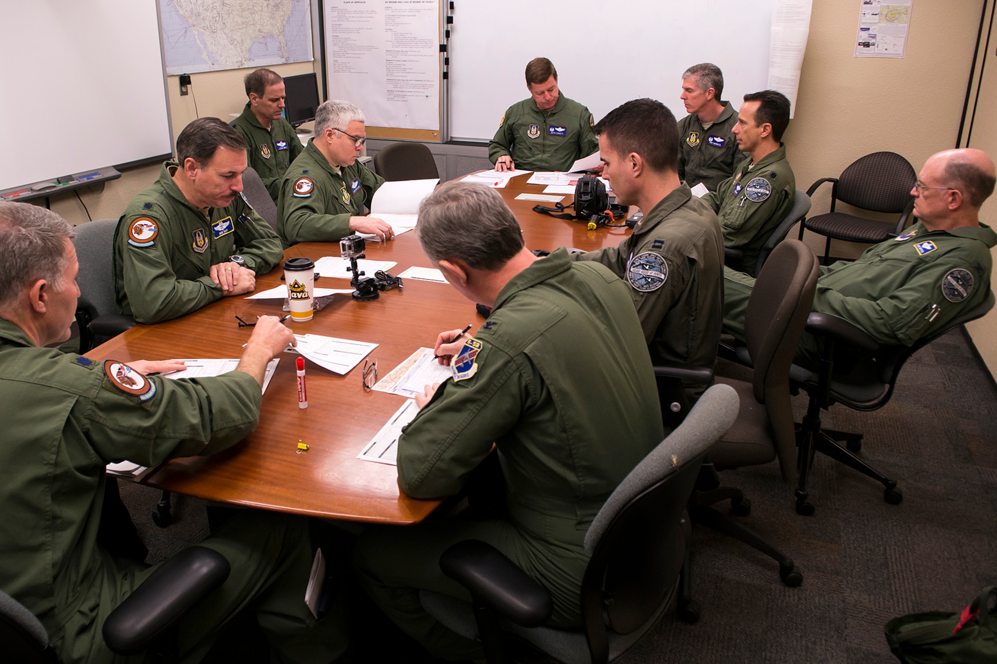 Aircrew gather for a preflight briefing prior to a mission, Feb. 18, 2014, Barksdale Air Force Base, La. The mission consisted of two B-52H Stratorfortress bombers, each consisting of a 10 man aircrew, totaling more than 100,000 flying hours. (U.S. Air Force photo by Master Sgt. Greg Steele/Released)